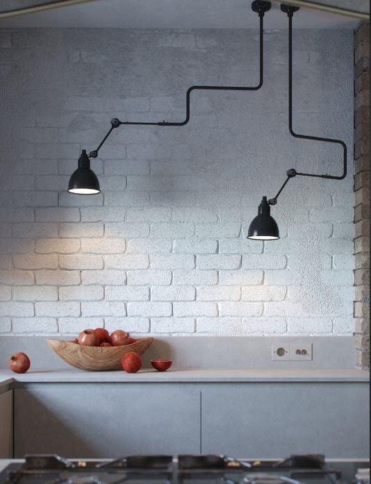 close-up with granates and white brick wall