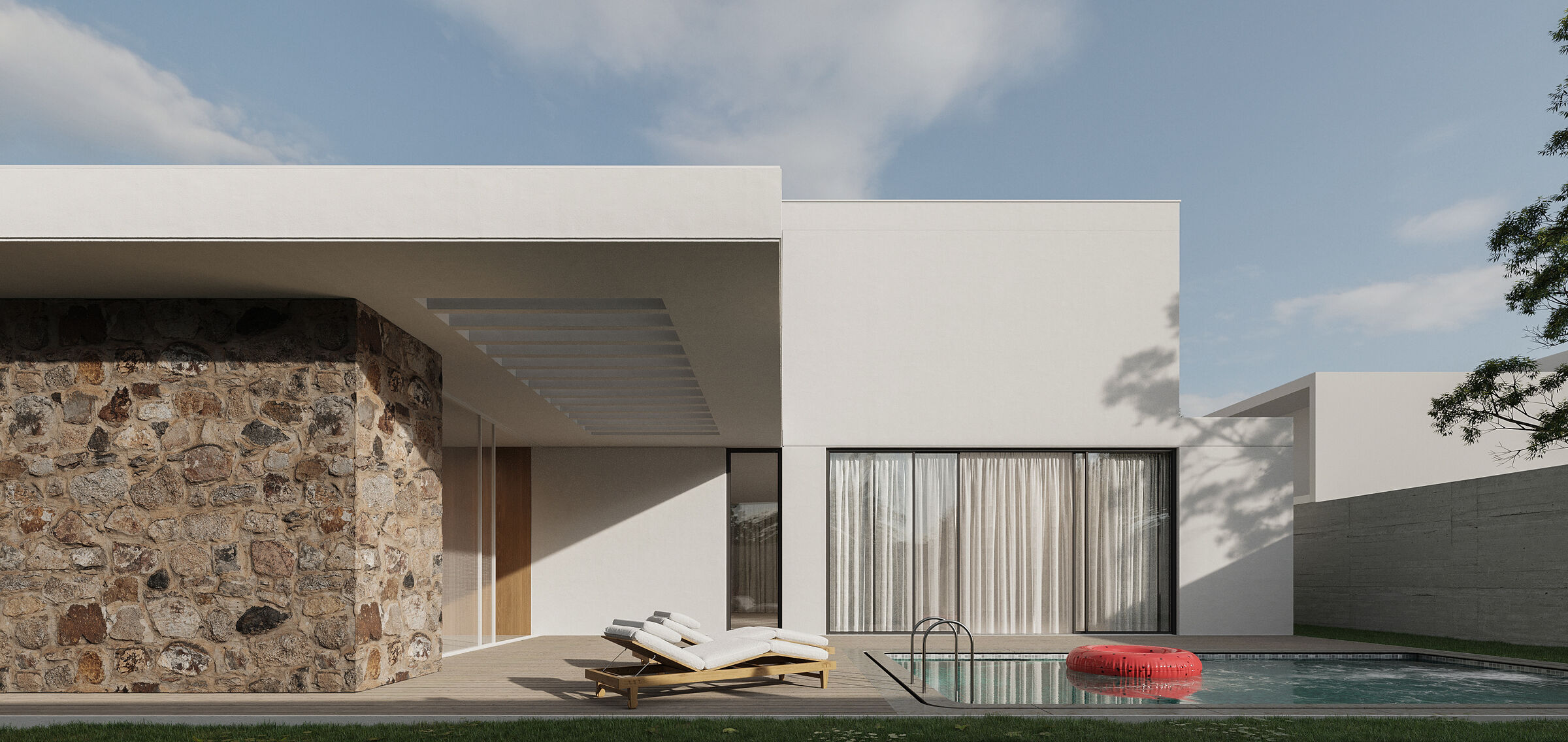 a courtyard with an open-air swimming pool and a green area decorated with local plants.