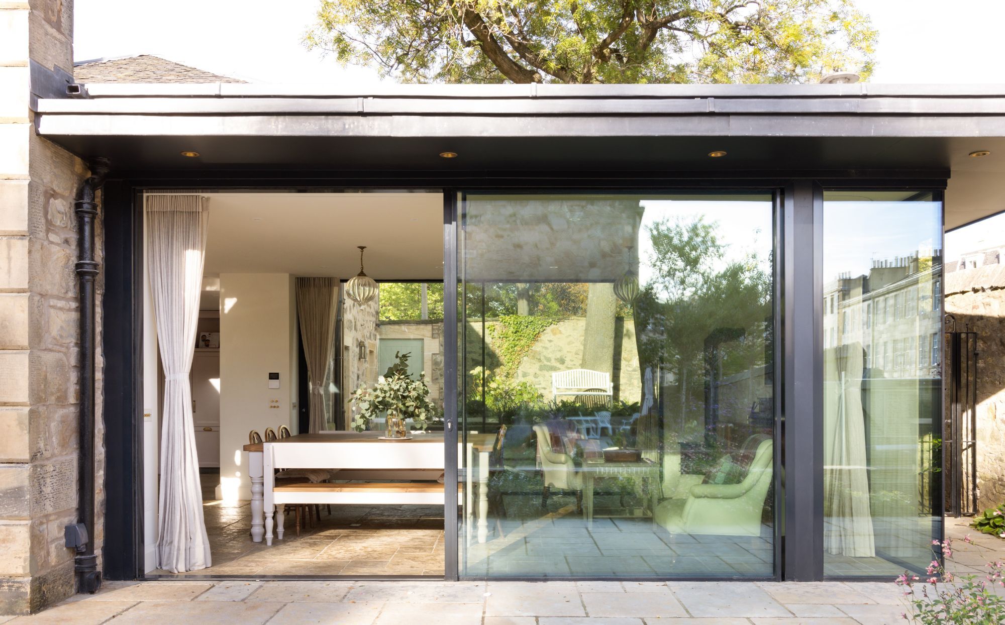 Fusion between traditional materials and contemporary energy efficient sliding glass doors