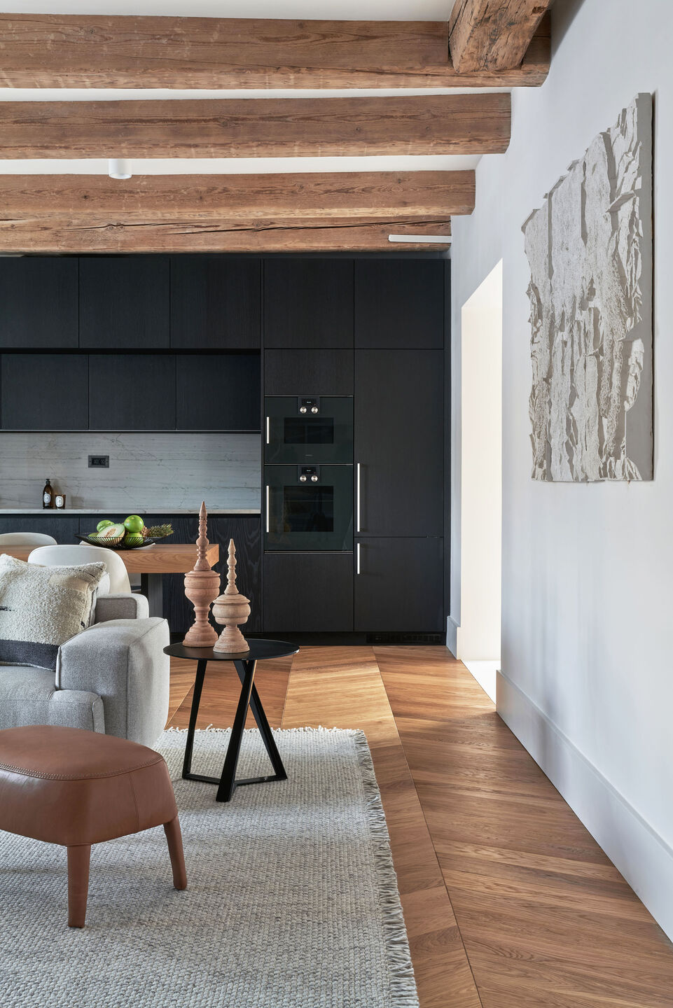 View from the living room towards the custom-made kitchen cabinetry.