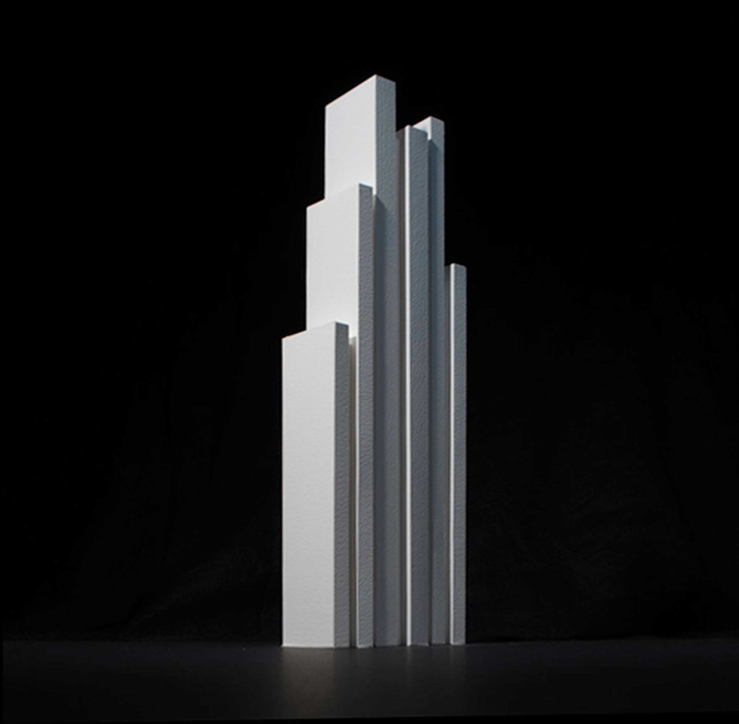 The form and massing was developed using iterations of card models.