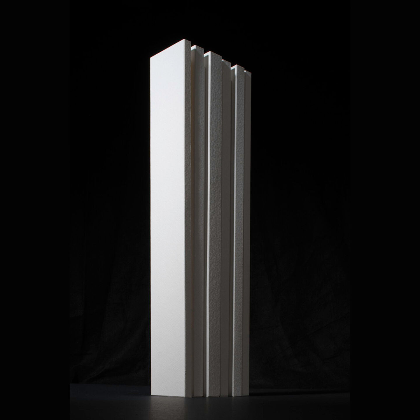 The form and massing was developed using iterations of card models.