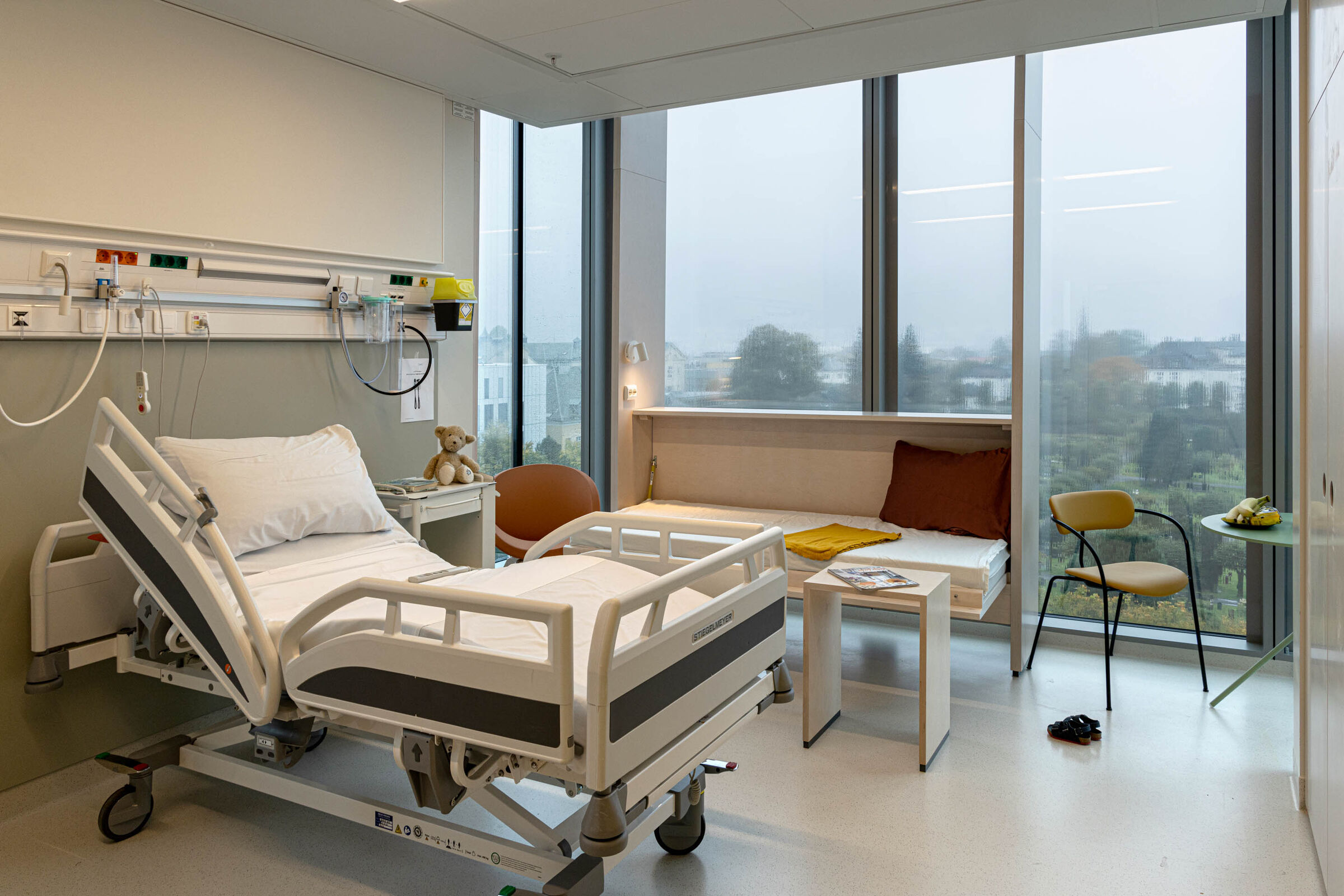 Patient rooms have an in-built extra bed for relatives