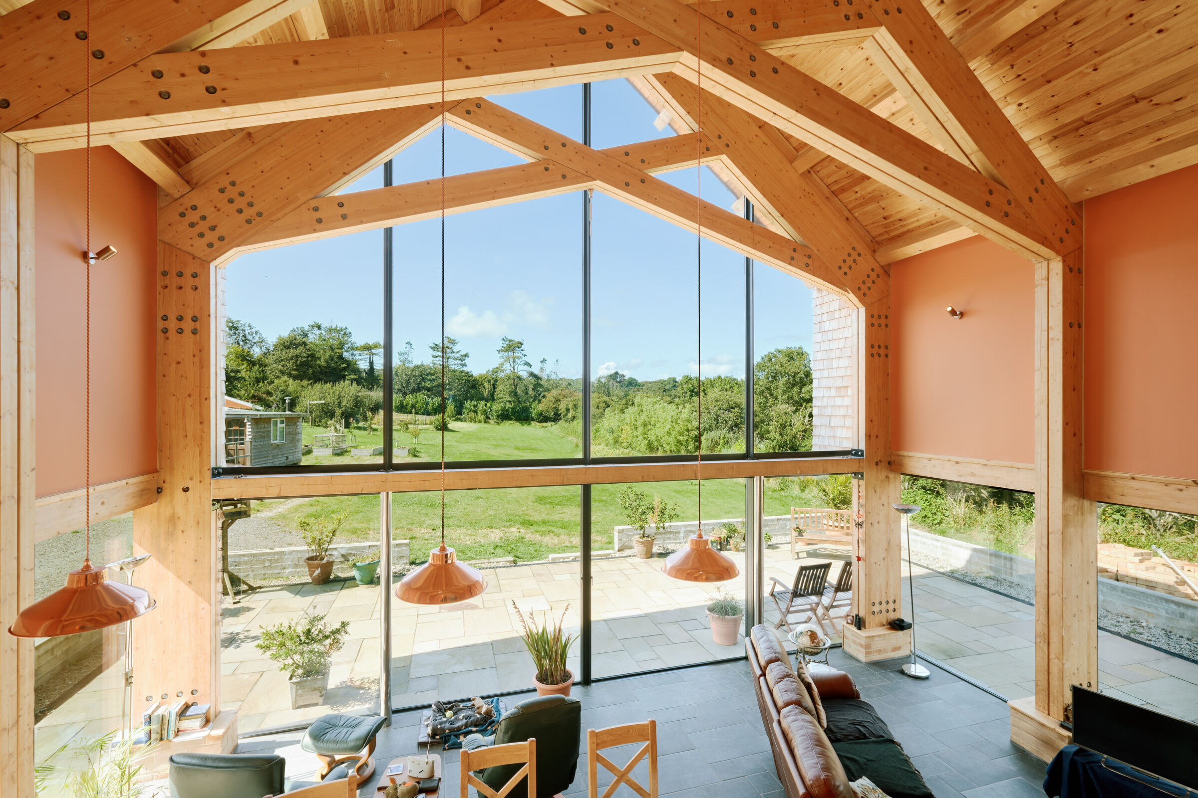 Timber roof with frameless glass enhances the beauty and natural light ingress.