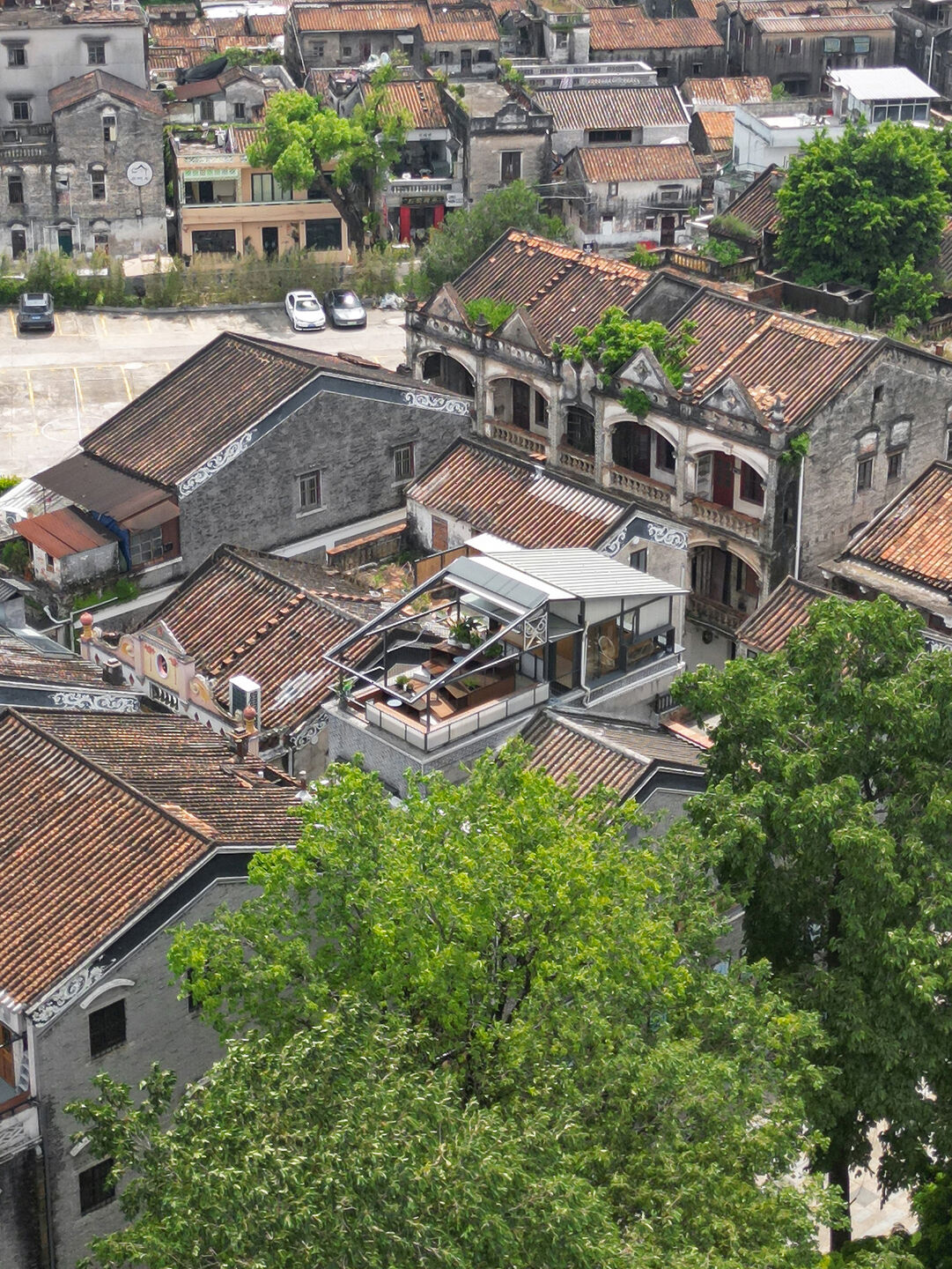 Top-level aerial view, terraced seating area with a panoramic view