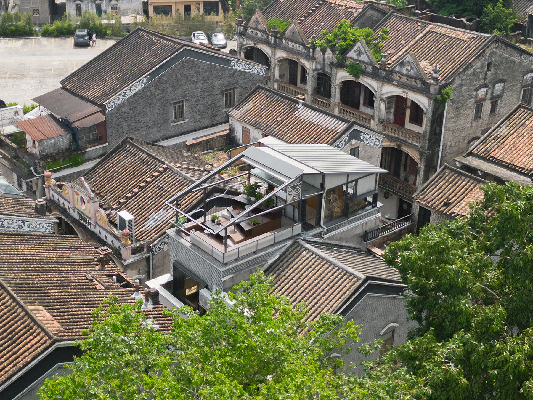 Aerial view，the roof of the new building continues the pitched roof form of the surrounding neighborhood