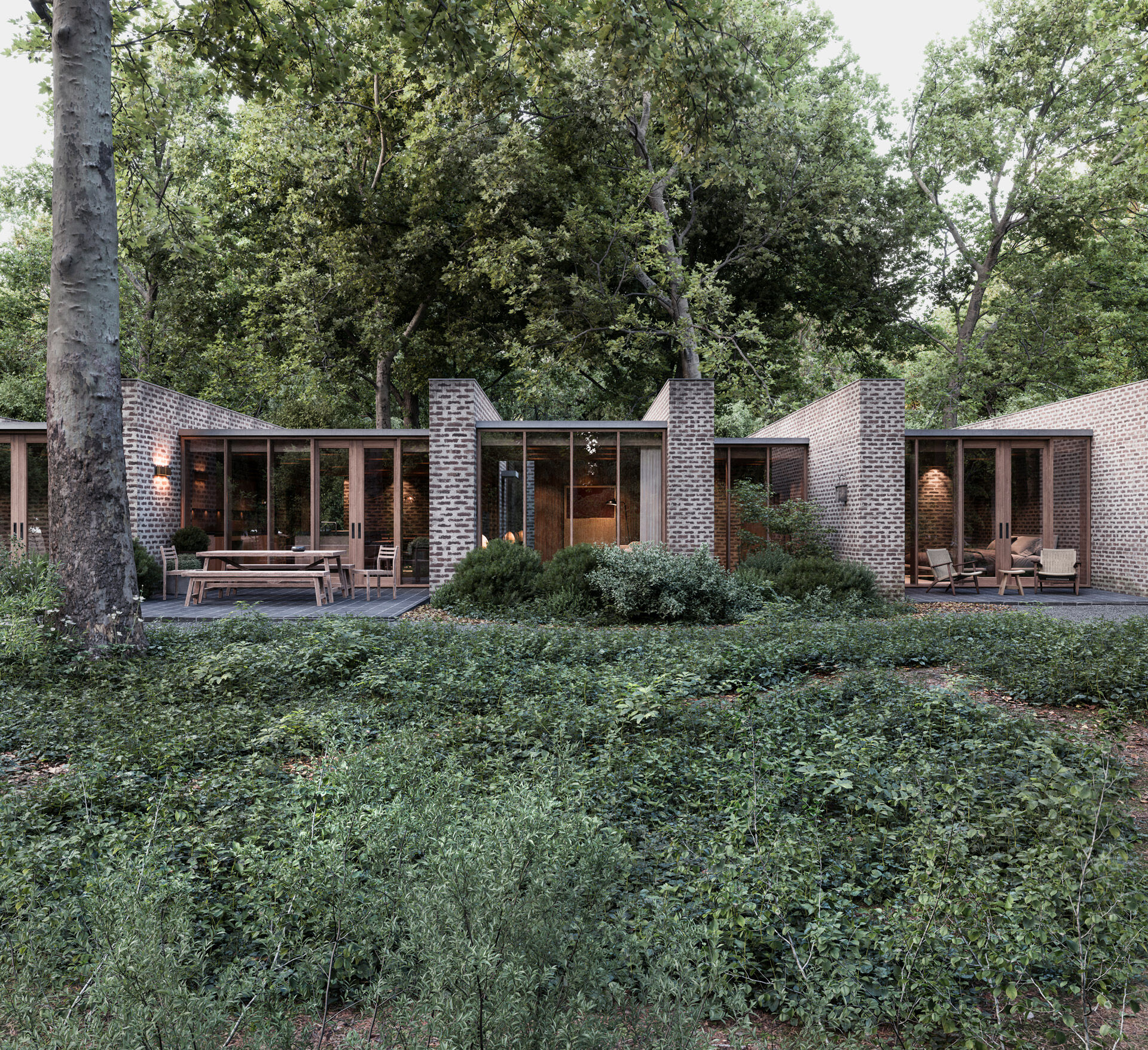 The brick walls extend outward to define and separate terraces along the rear of the house