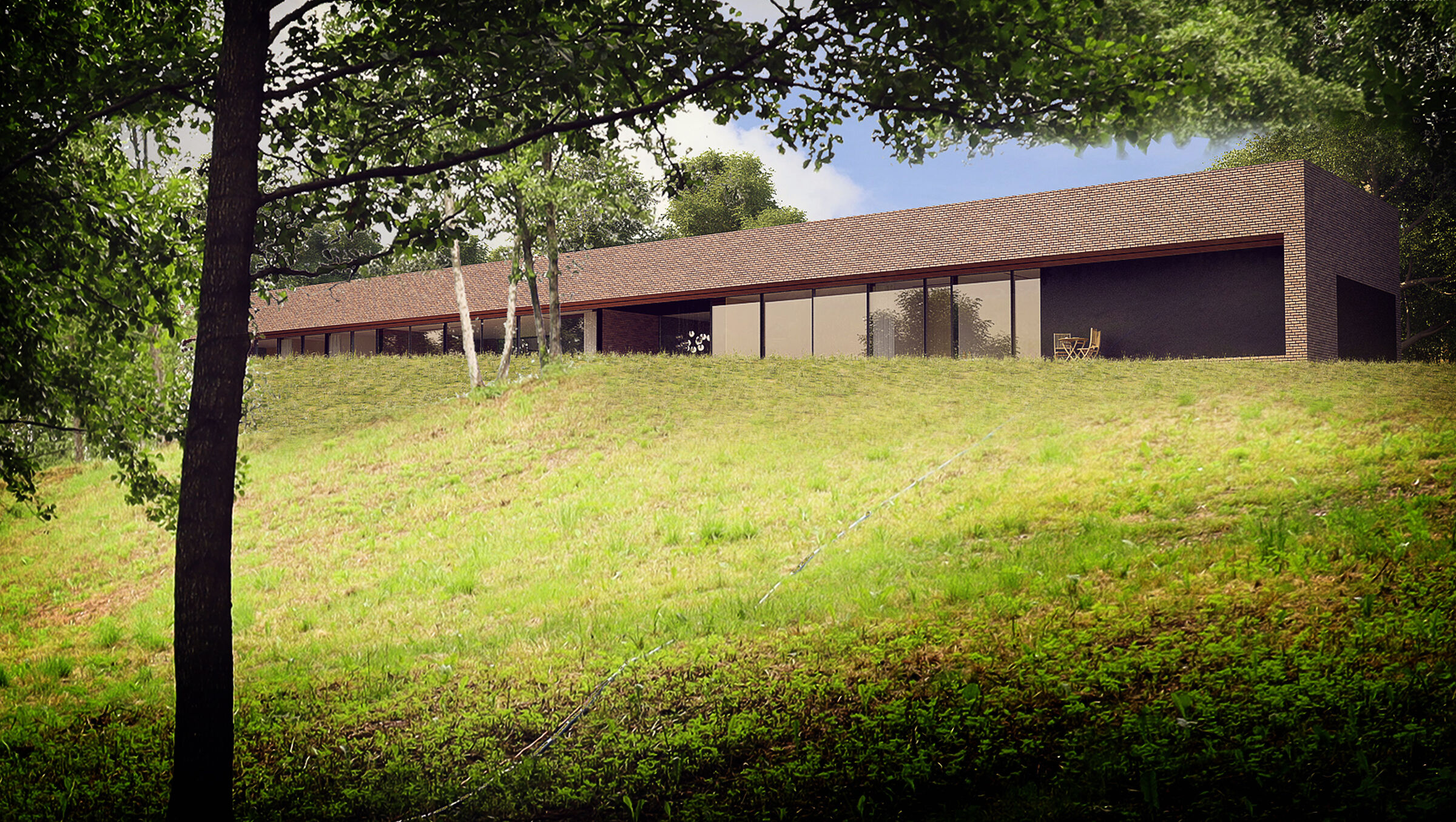 An elongated brick rectangle, placed on a hill by the lake, creates a horizontal line that frames the landscape through centrally placed, double-sided glazing.