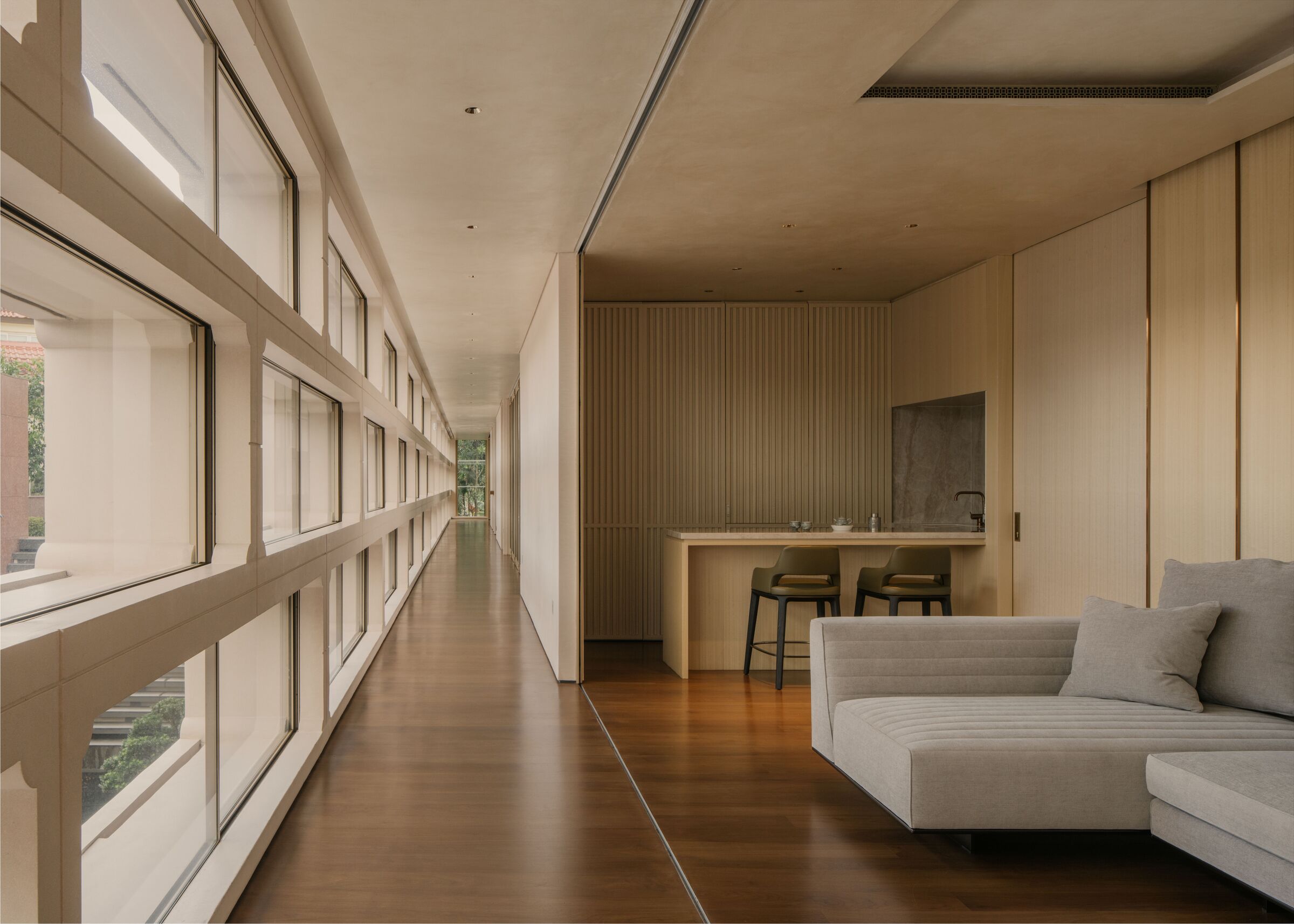 When the folding-sliding screens are open, the bedroom lounge becomes part of the family space.