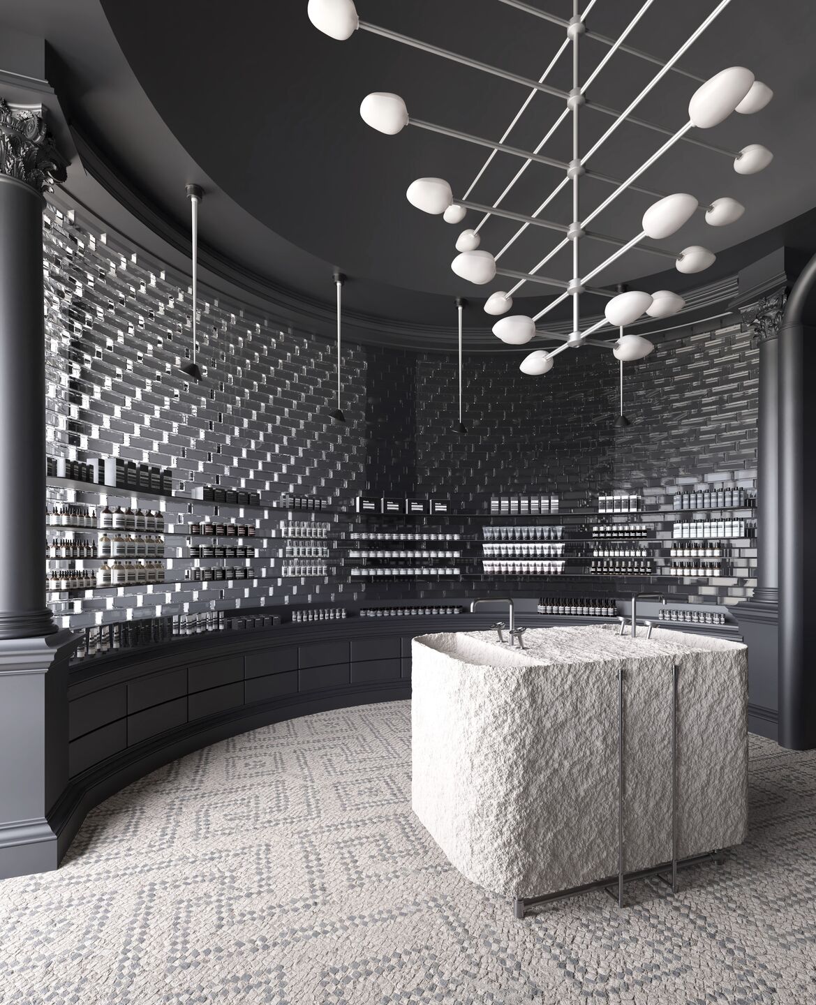 At the heart of it all: a monolithic central counter wrapped in tactile stone wool, evoking a sense of grounded purity.