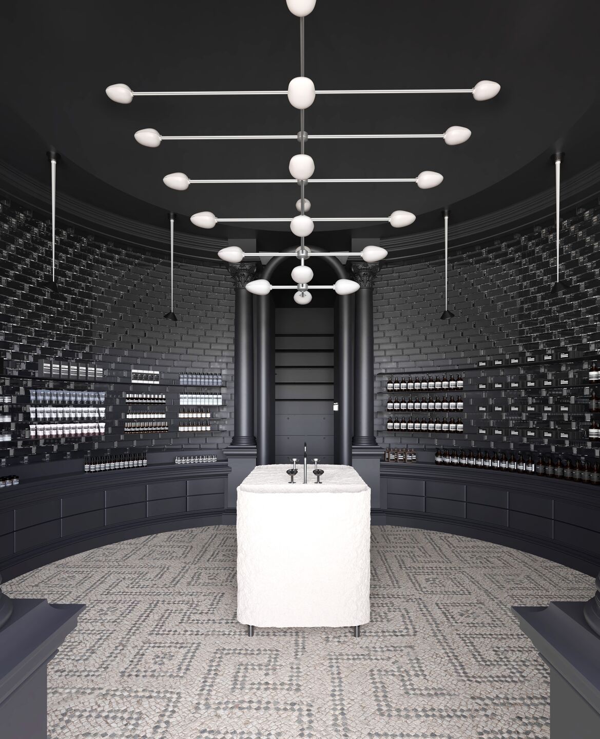 Lighting plays a sacred role. A floating constellation of frosted spheres casts soft halos, while vertical brass luminaires punctuate the shadows.