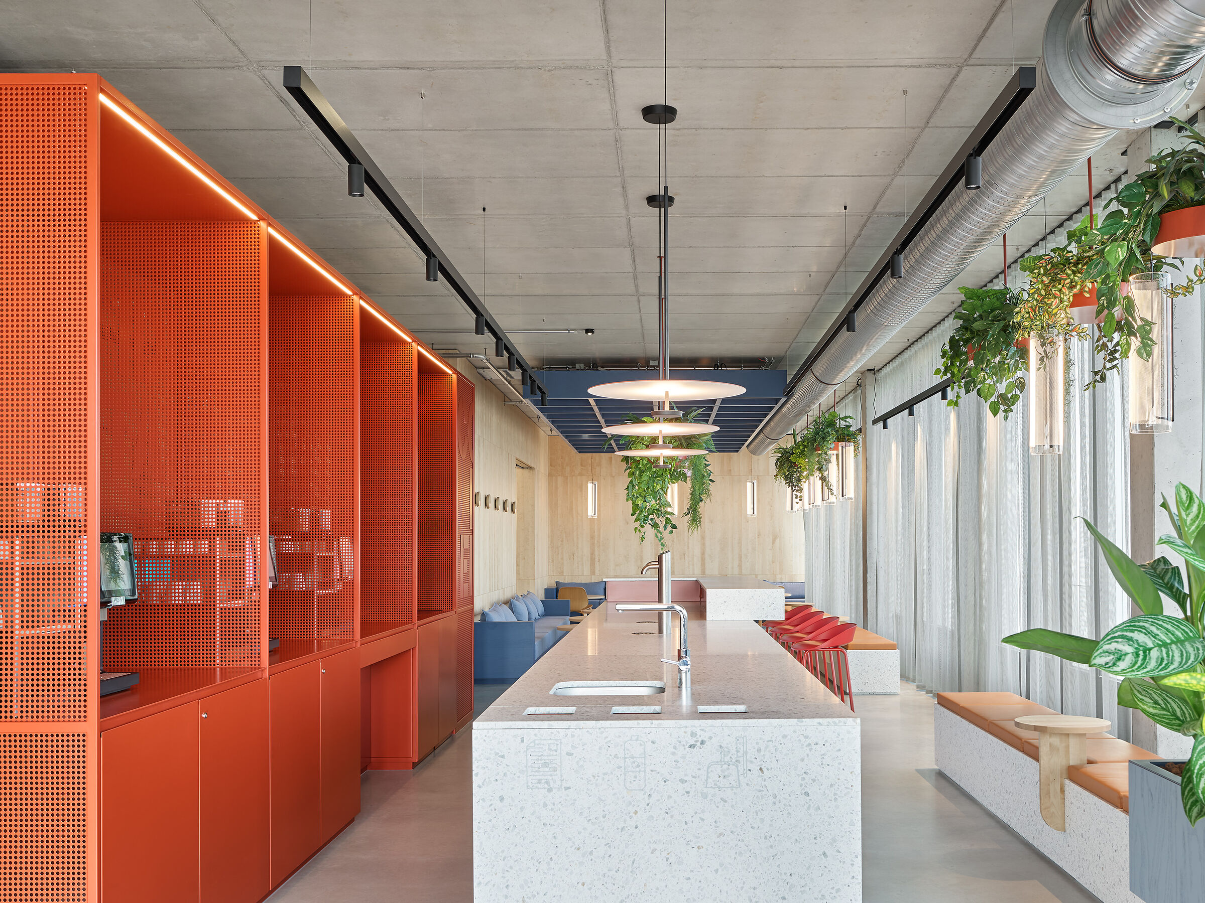 Cozy seating areas in the open-office space provide room for spontaneous brainstorming and collegial exchange.