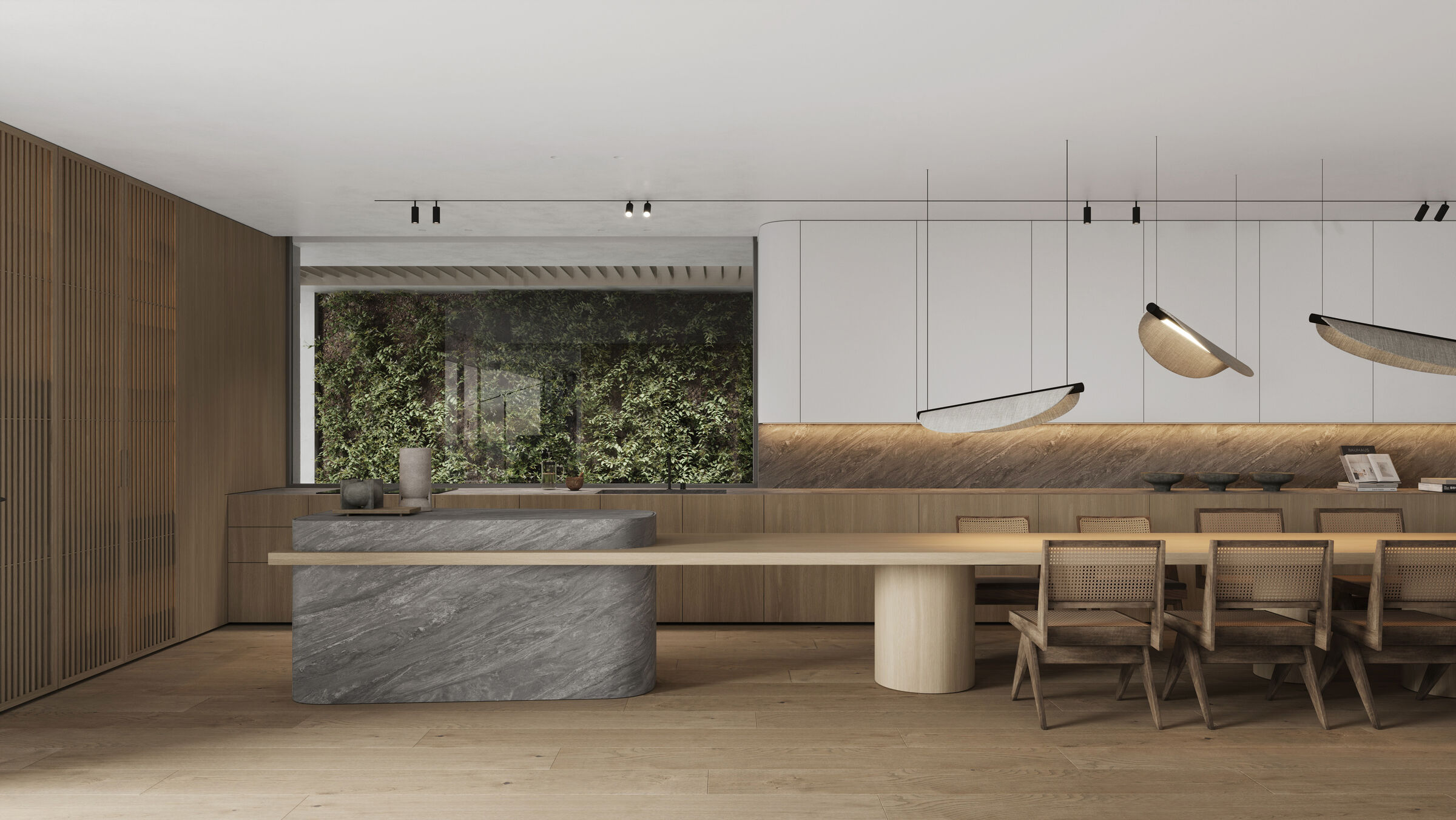 Solid stone island anchors the room and extends into a long wooden table for family meals.