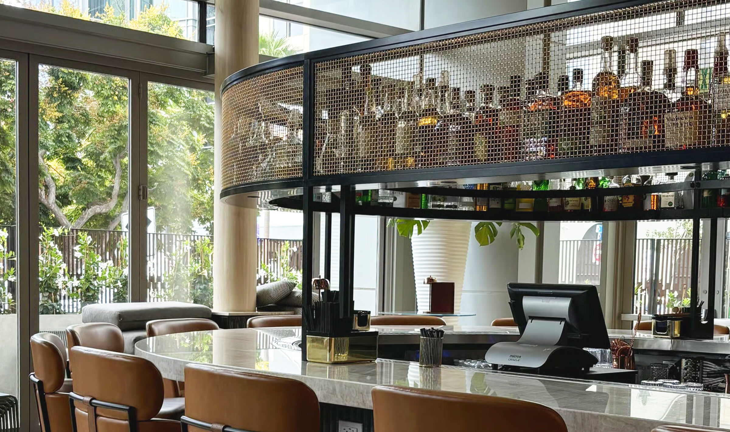 Close-up of L-441 architectural wire mesh woven in bare bronze at Ace Porter bar