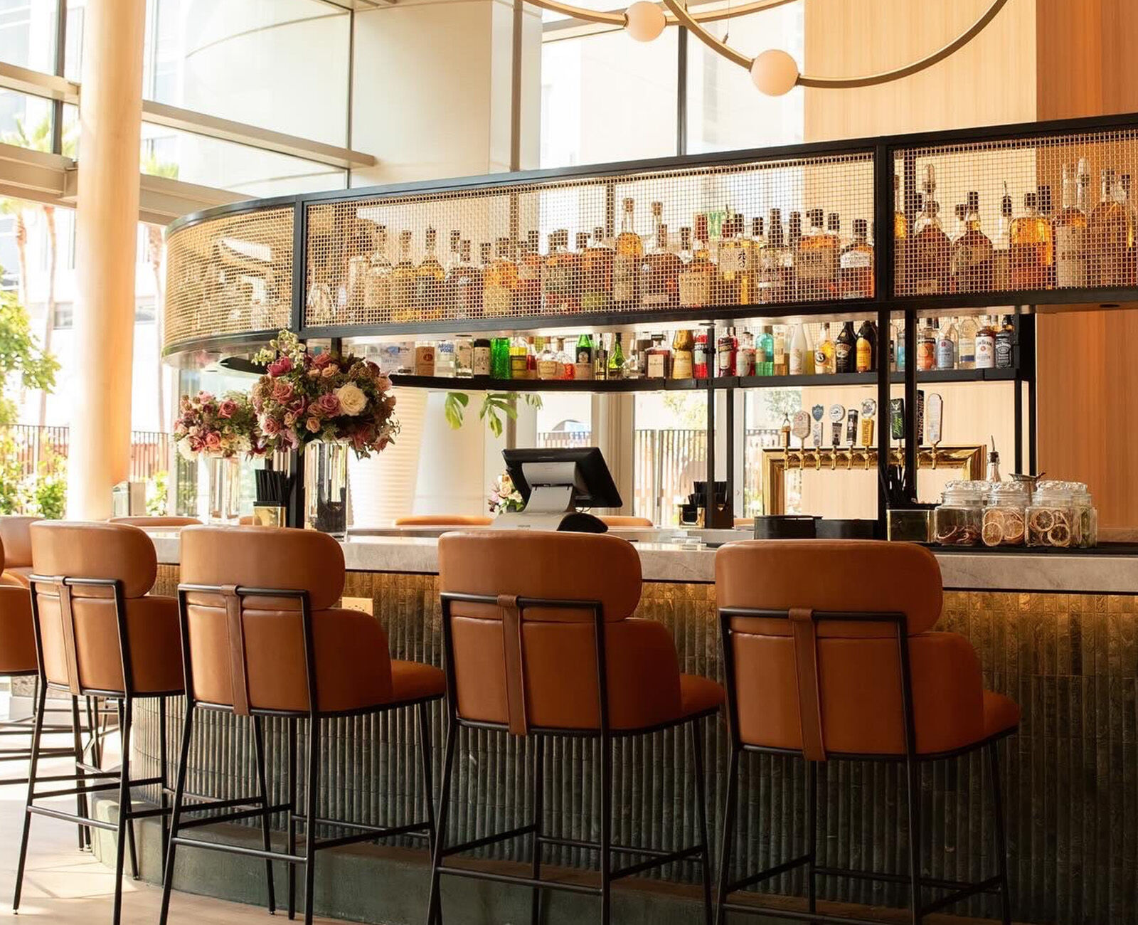 Industrial-chic bar environment with wire mesh textures and contemporary seating at Ace Porter