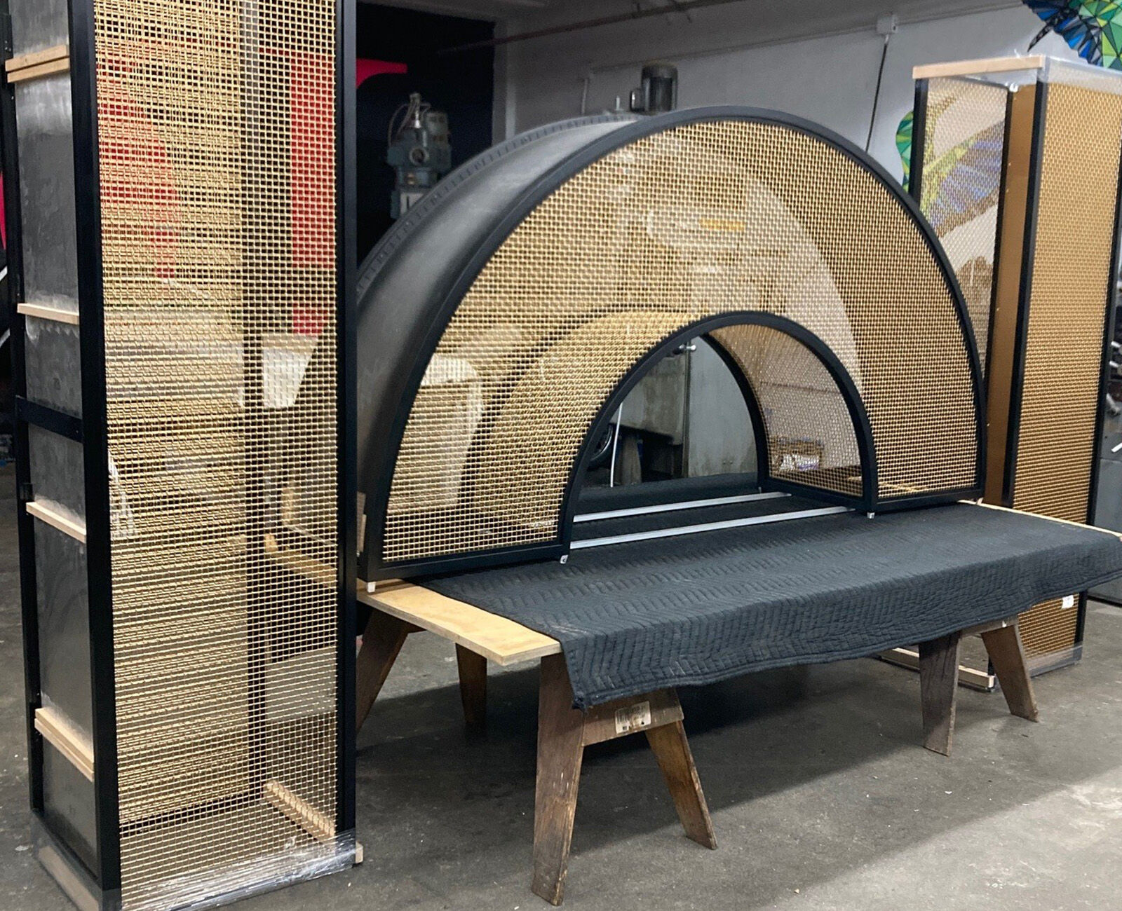 Curved bronze mesh archway designed and fabricated by Desposito Designs for the Ace Porter bar in the Omni San Diego