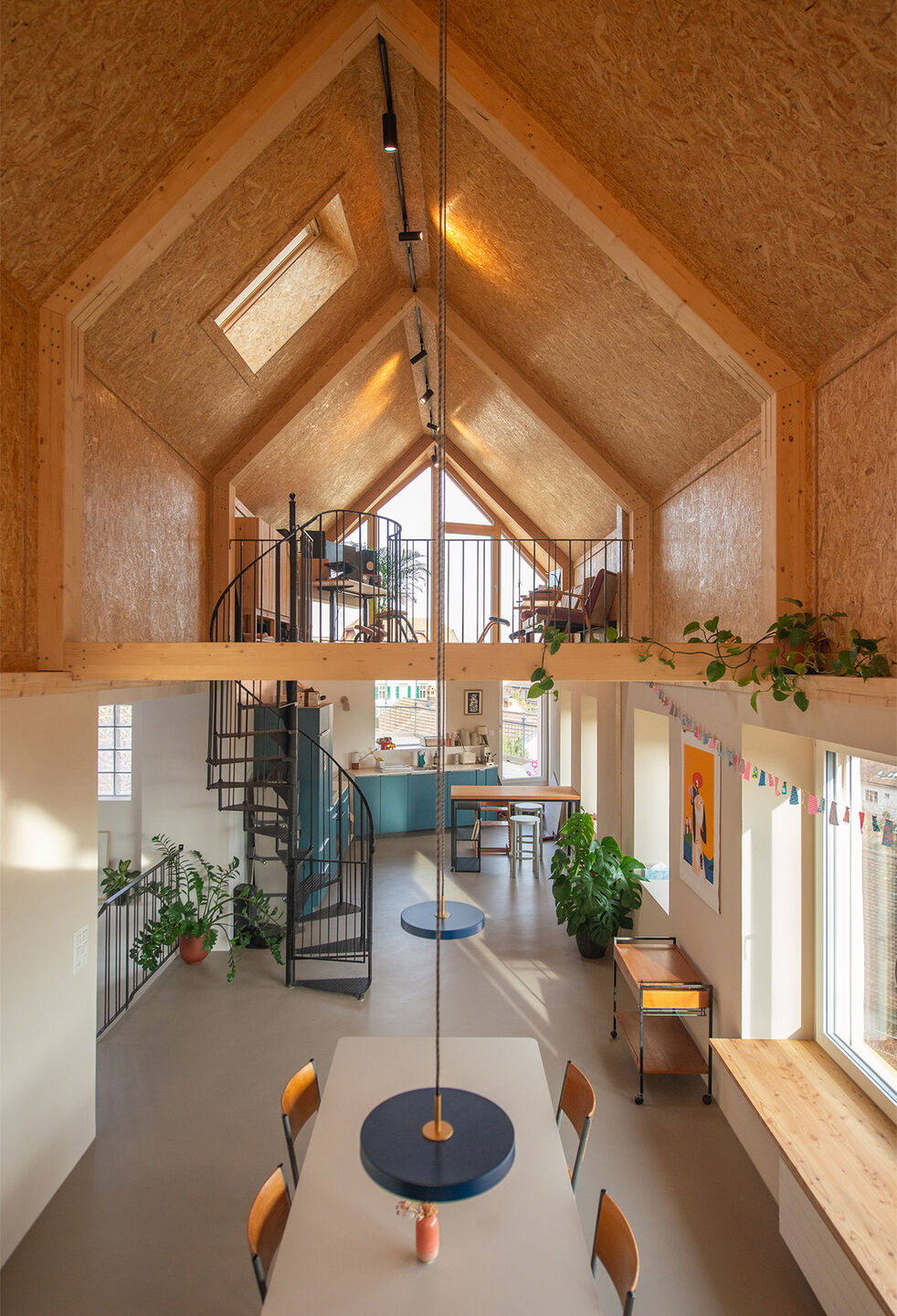 Interior view of the double-height rooftop space facing the kitchen