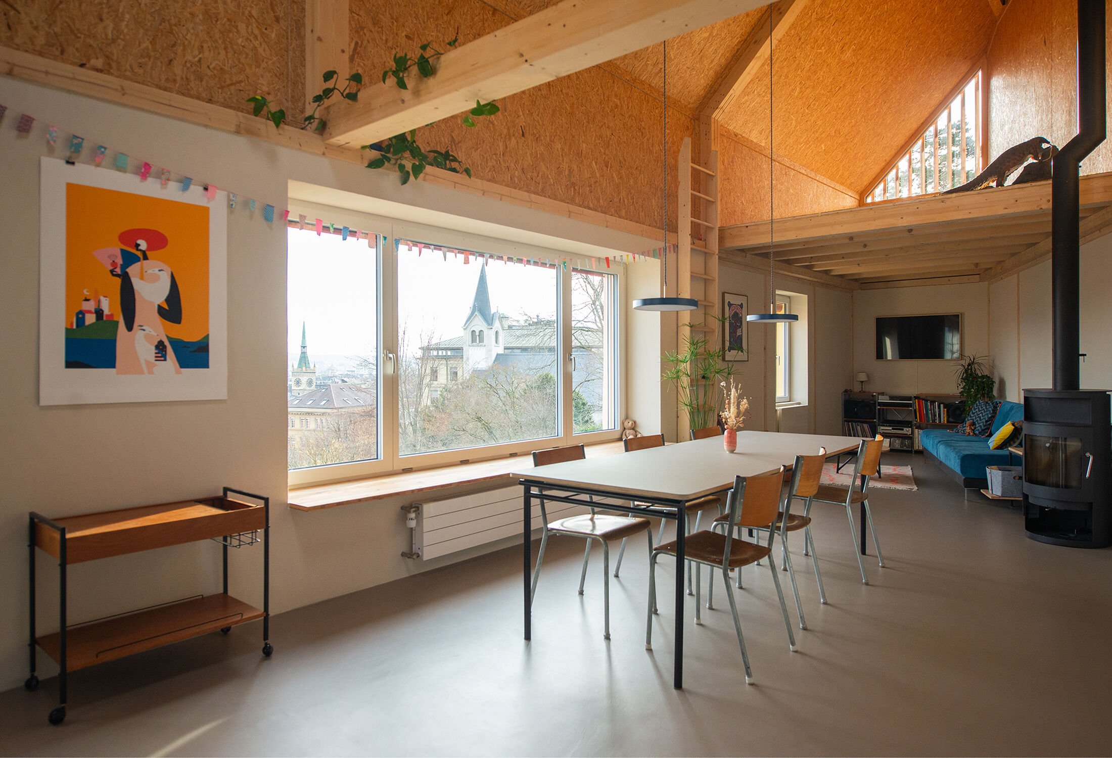View of the dining area with the panoramic window overlooking the landscape