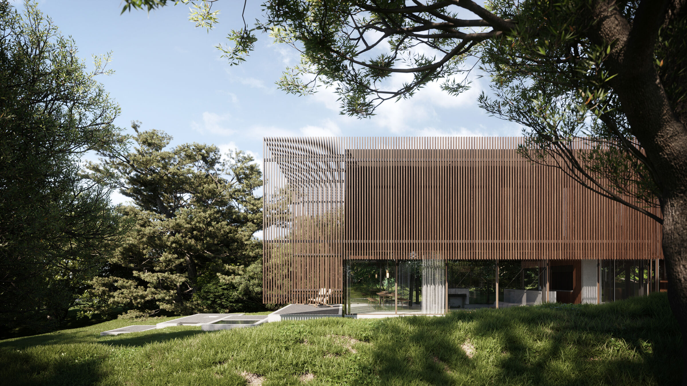 The first floor is overlaid with a ‘cradle'-like, slatted timber structure, to filter light, offer privacy and mimic the surrounding trees.