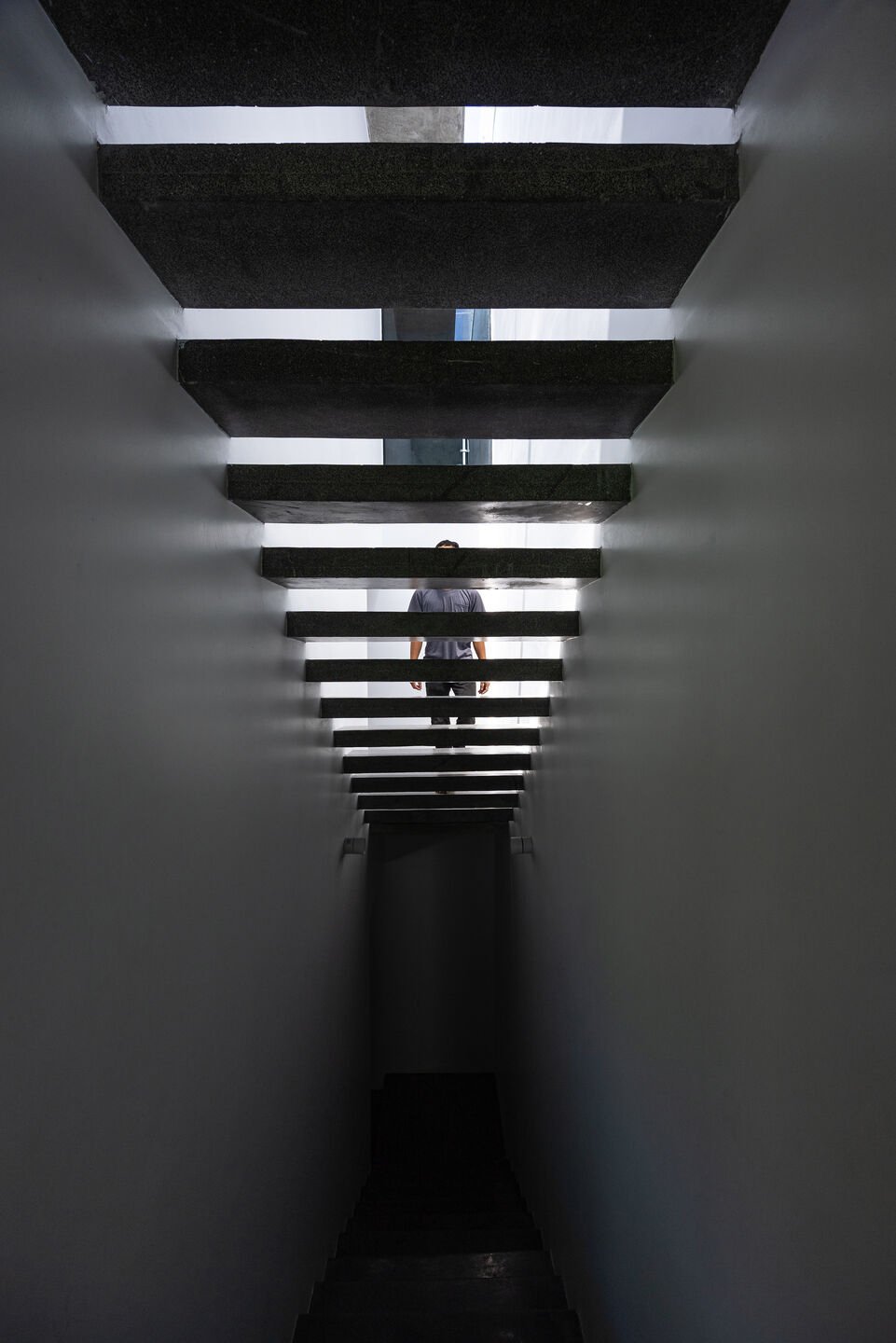 Concrete staircase with voids for daylight and ventilation