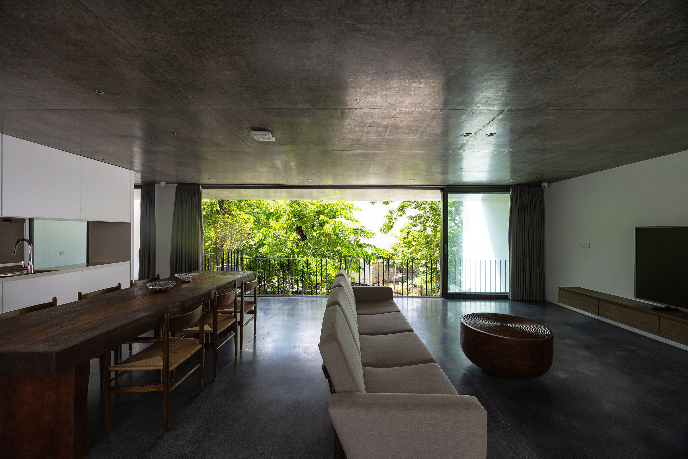 Family living space connecting front and rear areas with expansive views toward nature