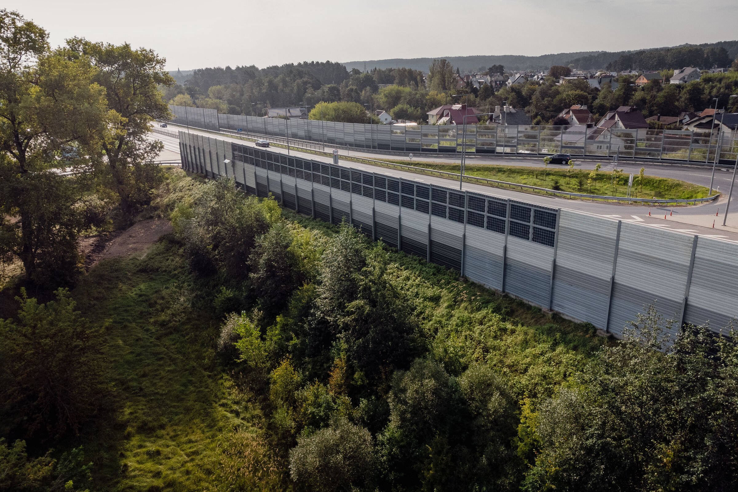 sound barrier with integrated solar panels near highway in Vilnius, Lithuania