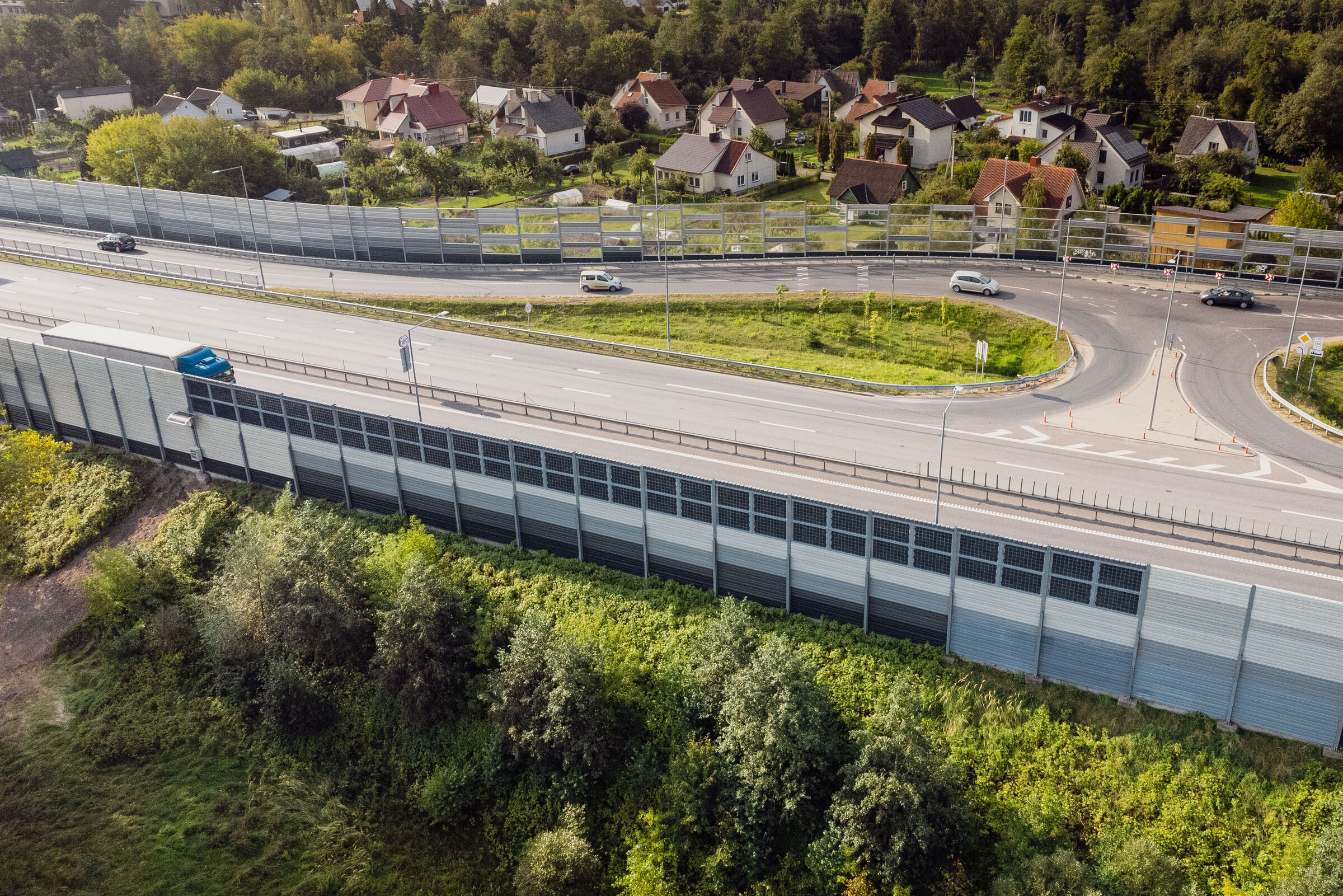 sound barrier with integrated solar panels near highway in Vilnius, Lithuania