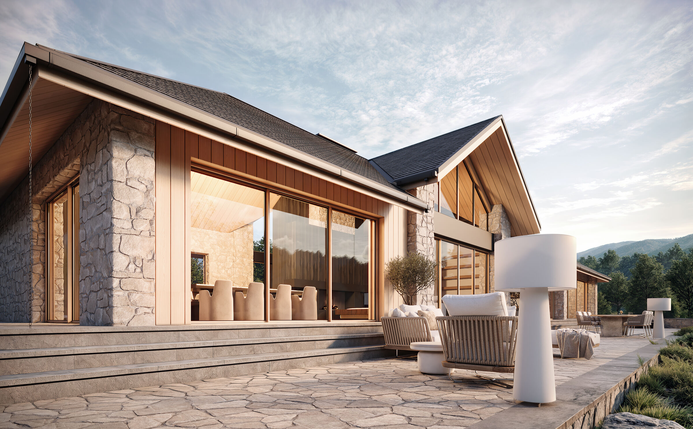 Large glazed openings frame distant views, connecting interior spaces with the mountain horizon.