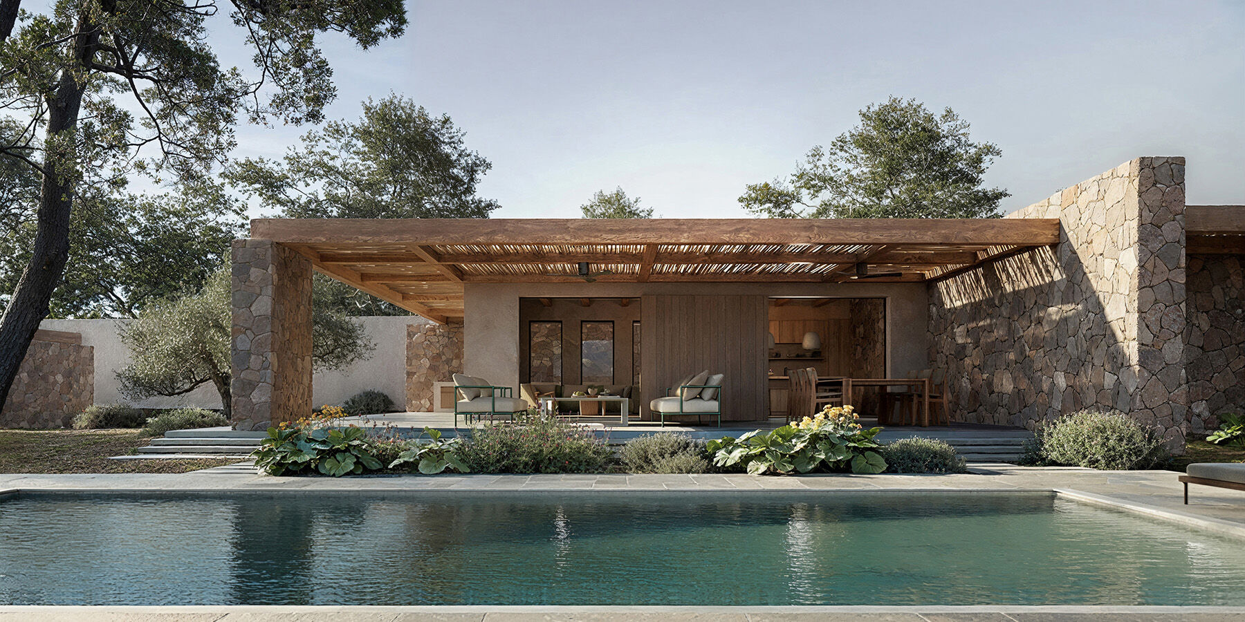 The social core opens fully toward the pool, with a reed-shaded pergola creating a transitional outdoor living space. copy
