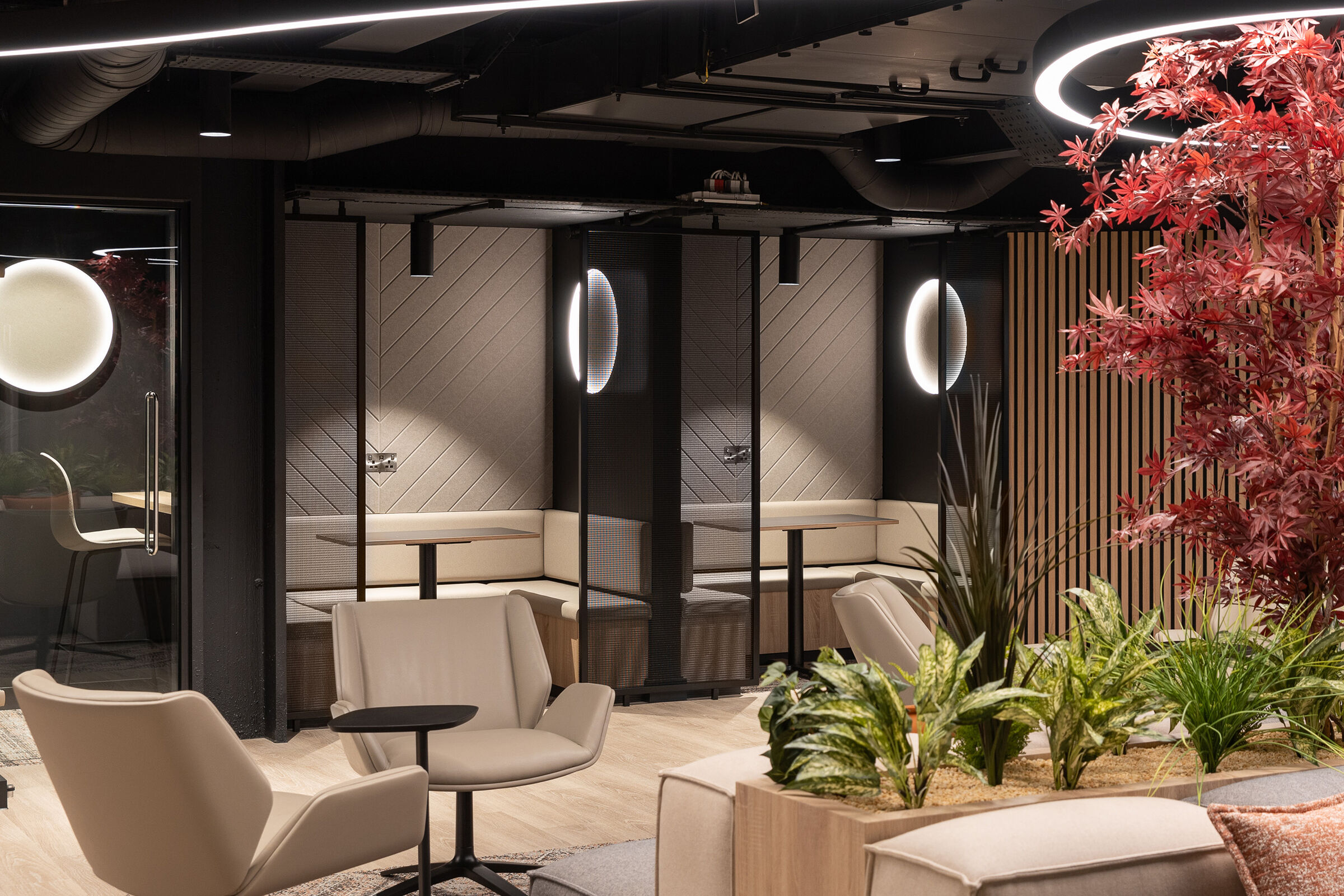Woven wire mesh space dividers in Banker LPZ-71 create semi‑private seating booths at 58 Mosley Street, adding to the collaborative workplace atmosphere.