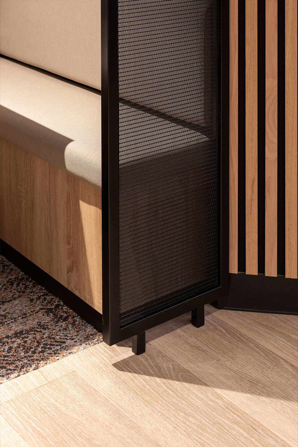 Woven wire mesh space dividers in Banker LPZ-71 create semi‑private seating booths at 58 Mosley Street, adding to the collaborative workplace atmosphere.