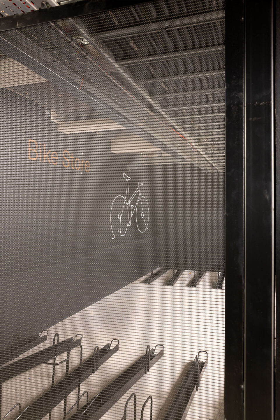 The secure bike storage area uses durable LPZ-71 woven wire mesh panels to provide visibility, ventilation, and long‑lasting protection.