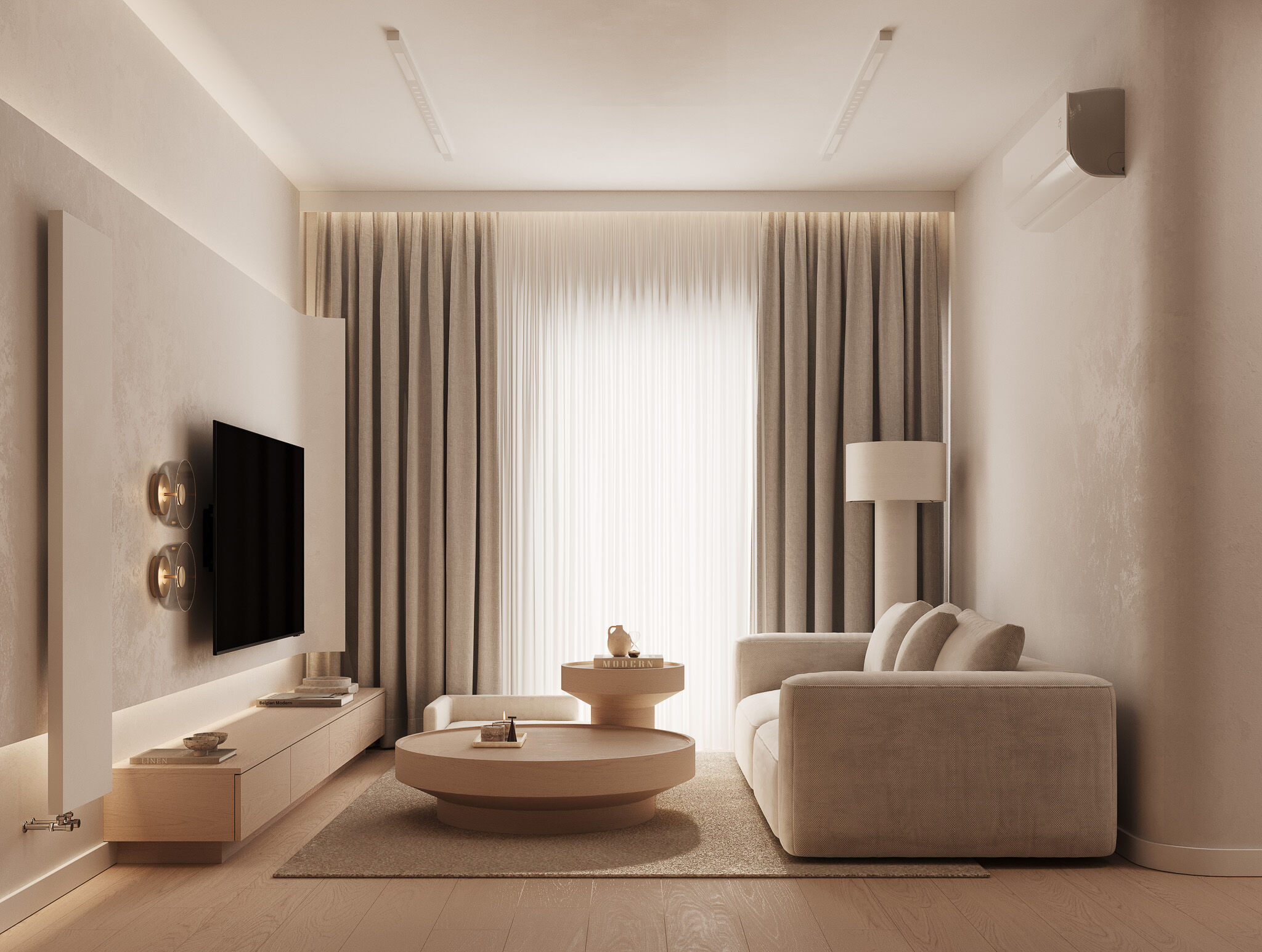 The living area is composed as a calm, light-filled setting, where textures and proportions create a sense of quiet comfort.