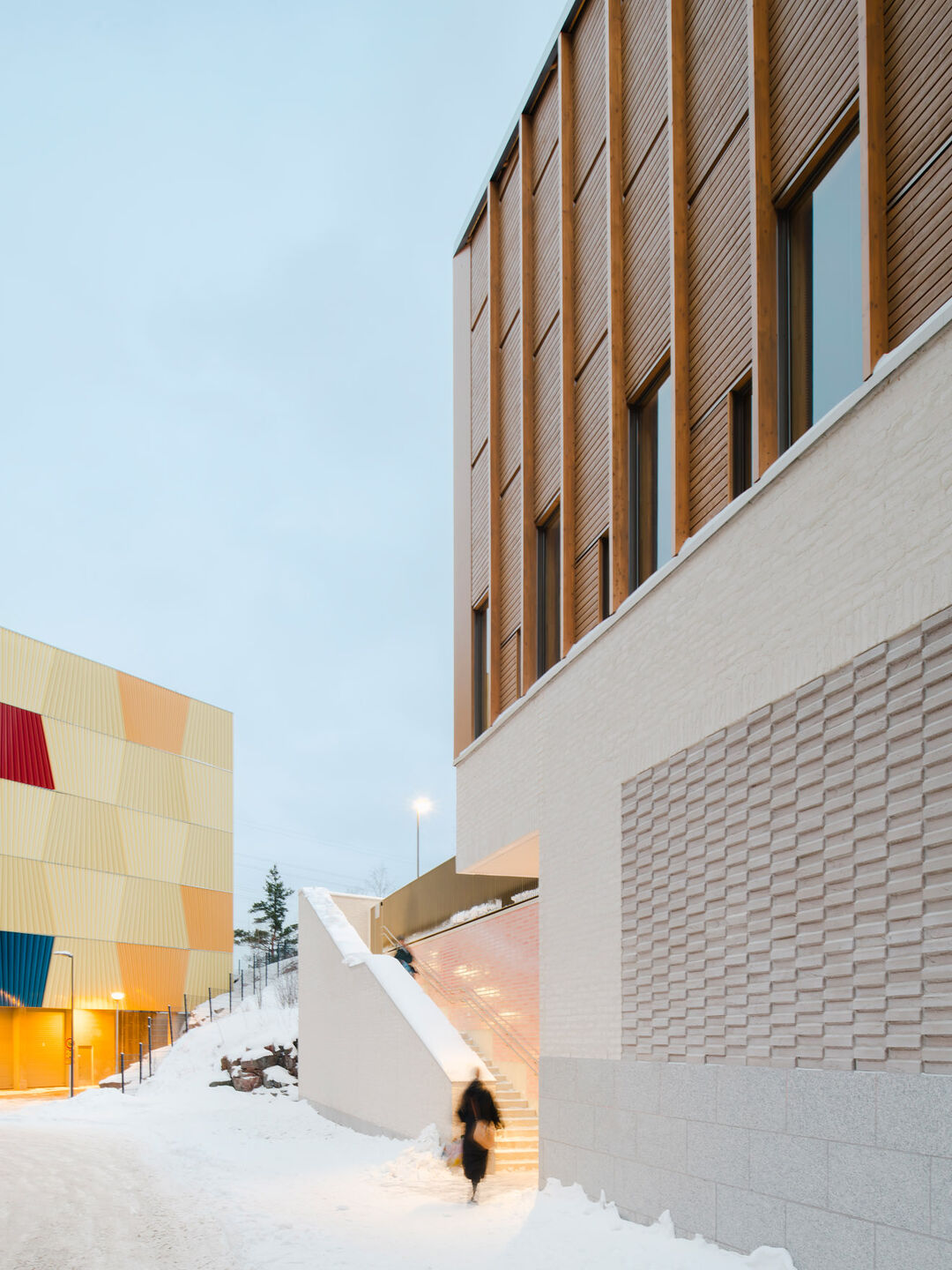 The recesses are emphasized with coloured glazed bricks and relief masonry.
