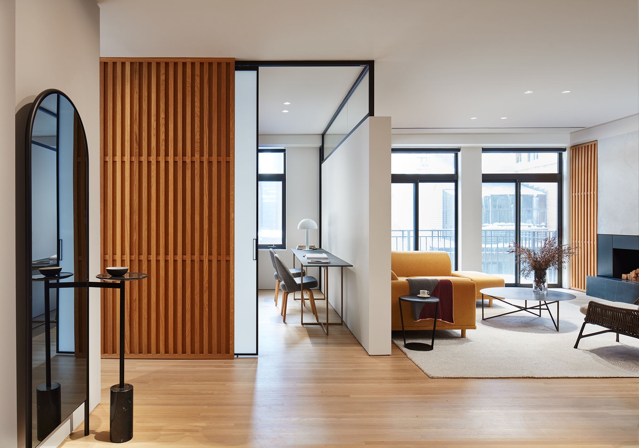 A modern hall tree grounds the entry.