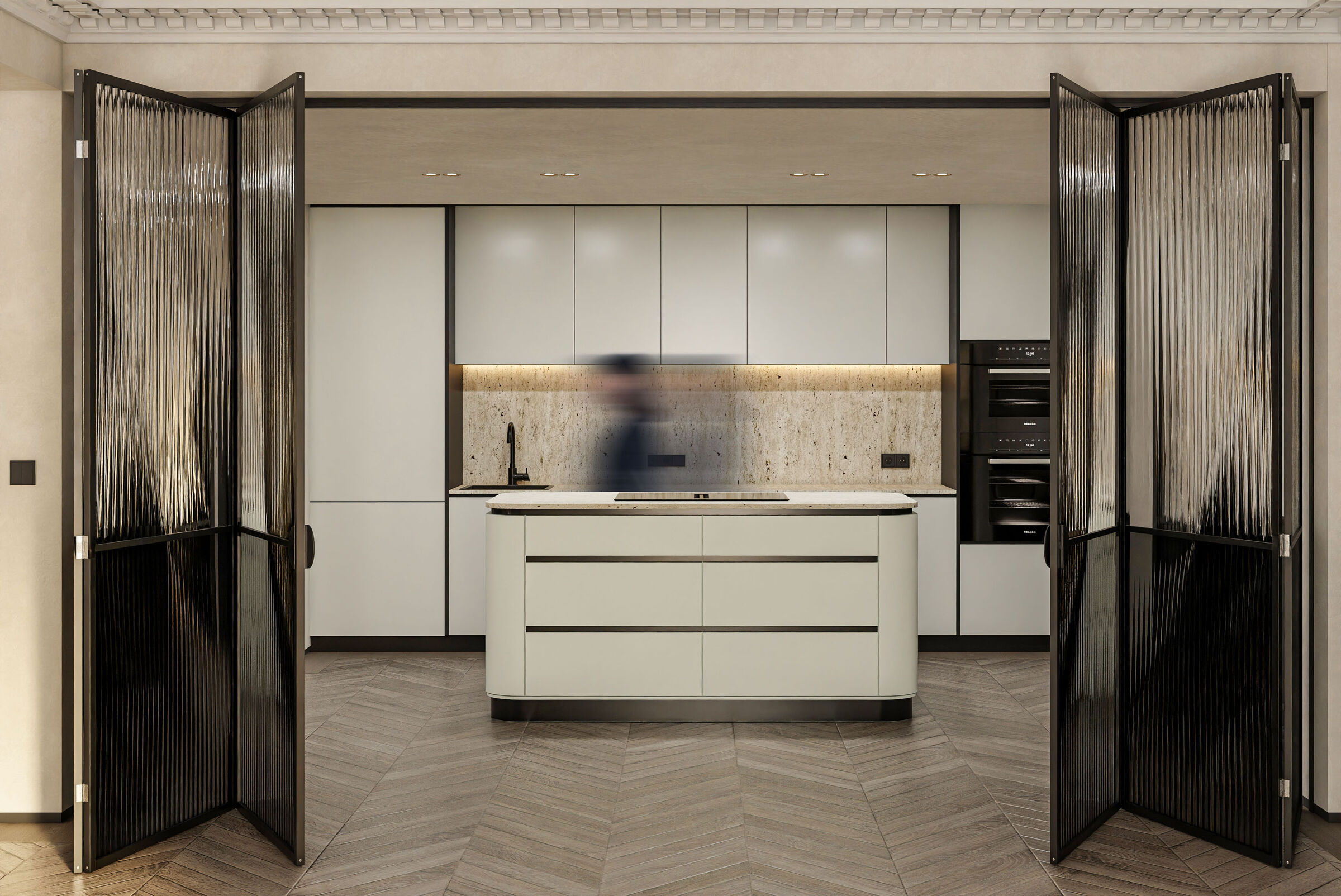 A minimalist kitchen in central Athens combines bespoke cabinetry, natural stone finishes, and folding partitions, introducing flexibility and contemporary functionality into the renovated apartment.