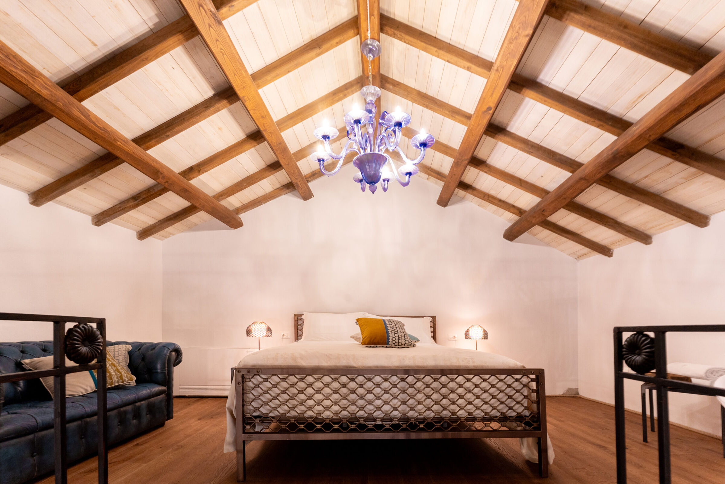 High-end hotel room featuring Volcano handmade iron bed, designed for durability and comfort
