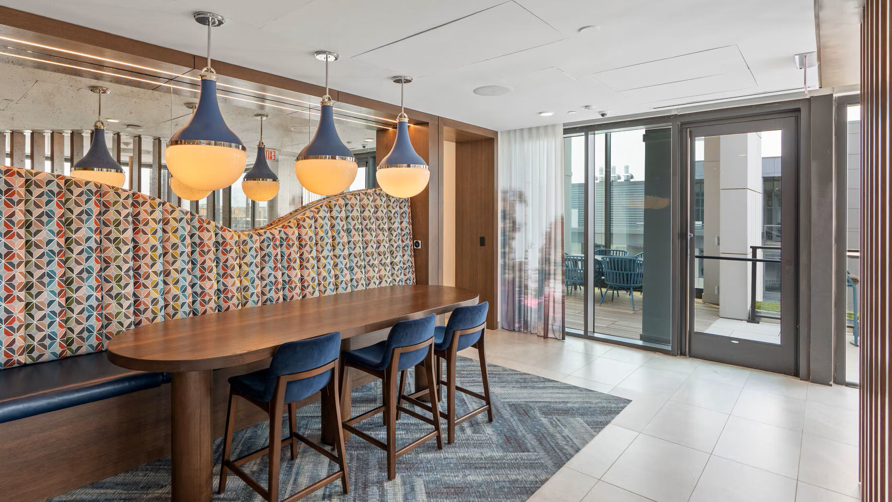 Interior details designed by Forrest Perkins, a distinct studio of Perkins Eastman. Featuring Gutmann Terrace Door and Curtain Wall