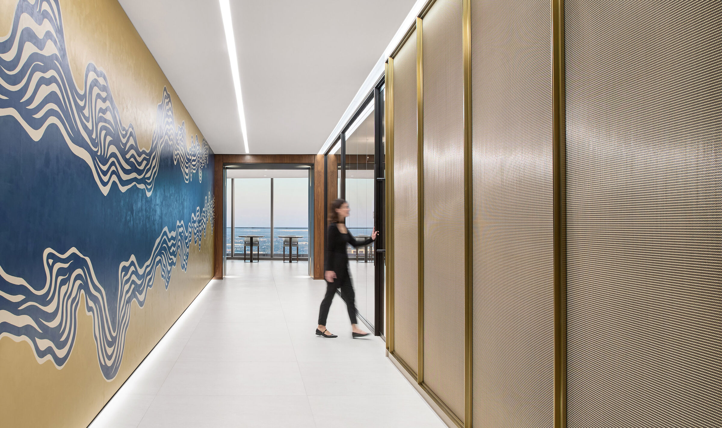 Decorative woven wire mesh IPZ-25 installed in corporate interior design as a space divider.