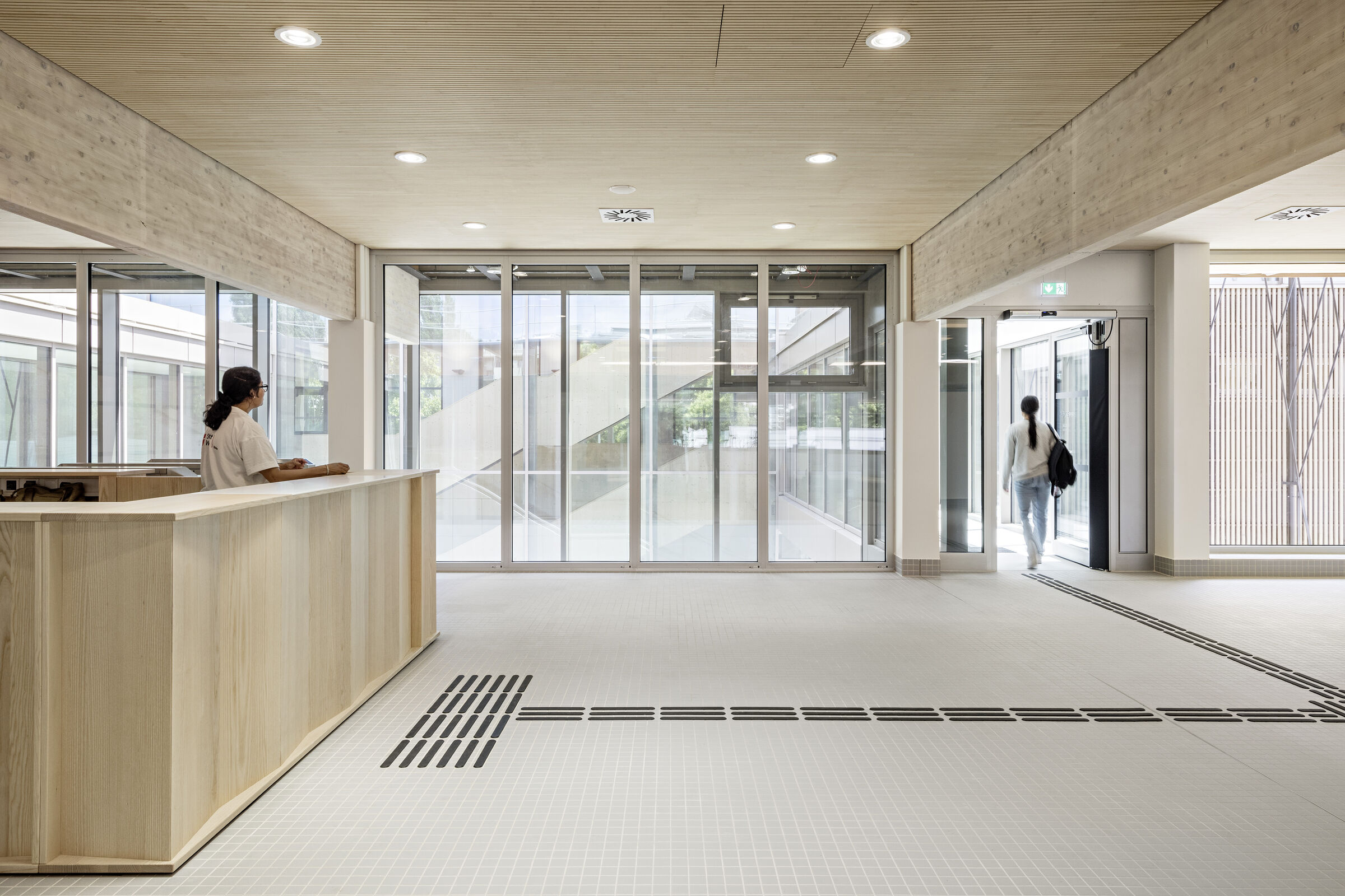 The bridges connect the new foyer with the existing entrance hall.