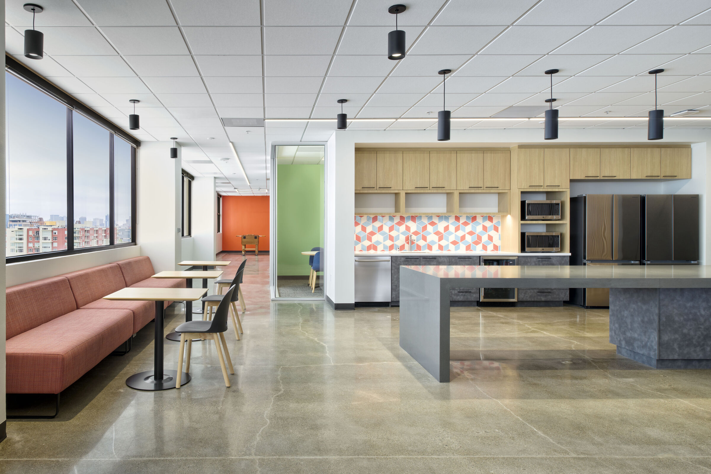 Open break area with Emeryville views and an abundance of daylight invites gathering while staying connected; bright accents define zones and energize the workplace.
