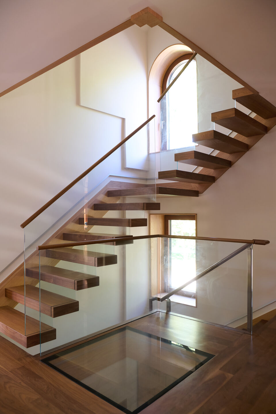 Accessible Masonry Gut Renovation - Floating Staircase with Glass Railing.