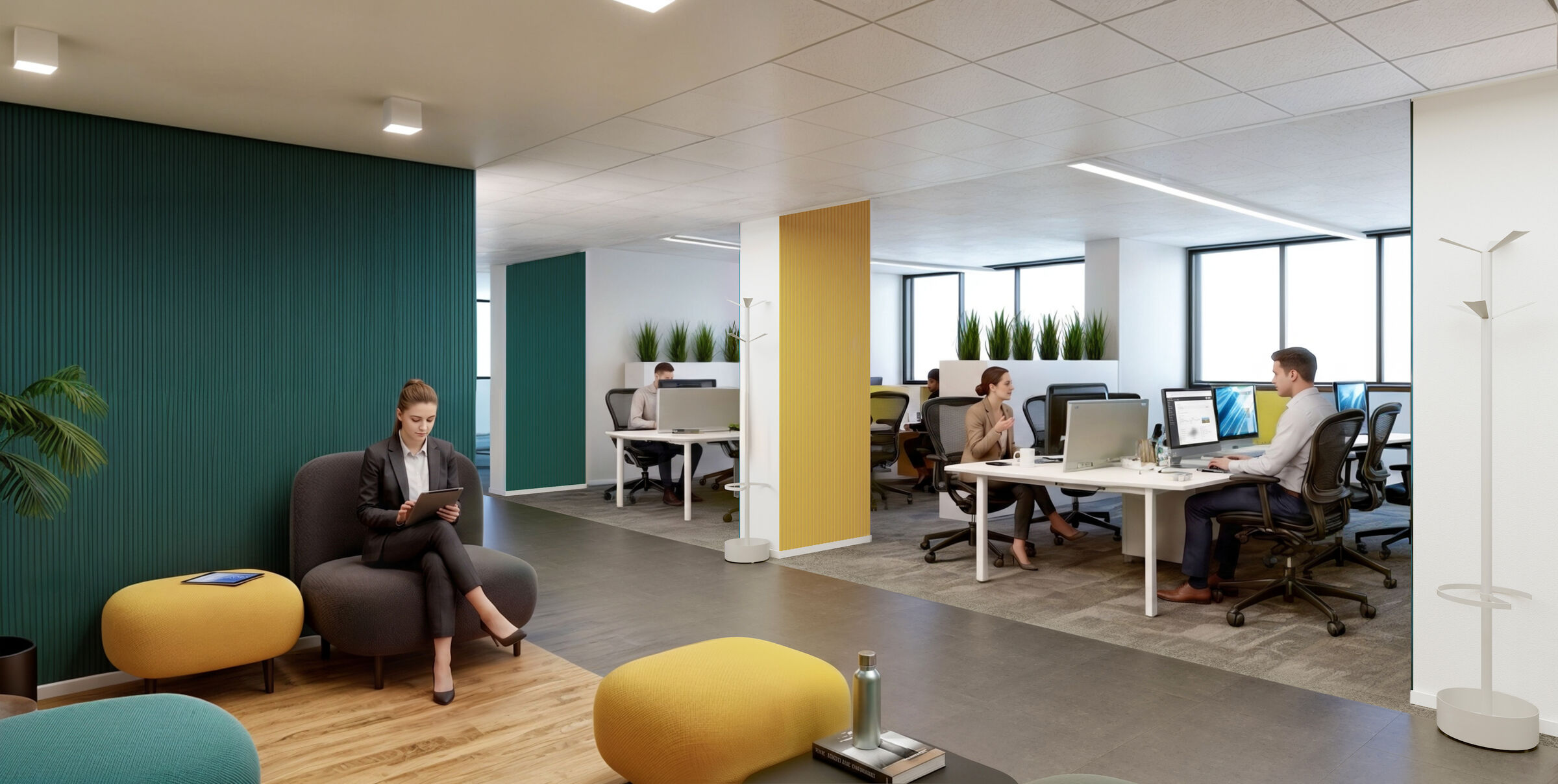 A social area overlooking the open-plan space on the second floor, with colourful pouffes and workstations at the back.