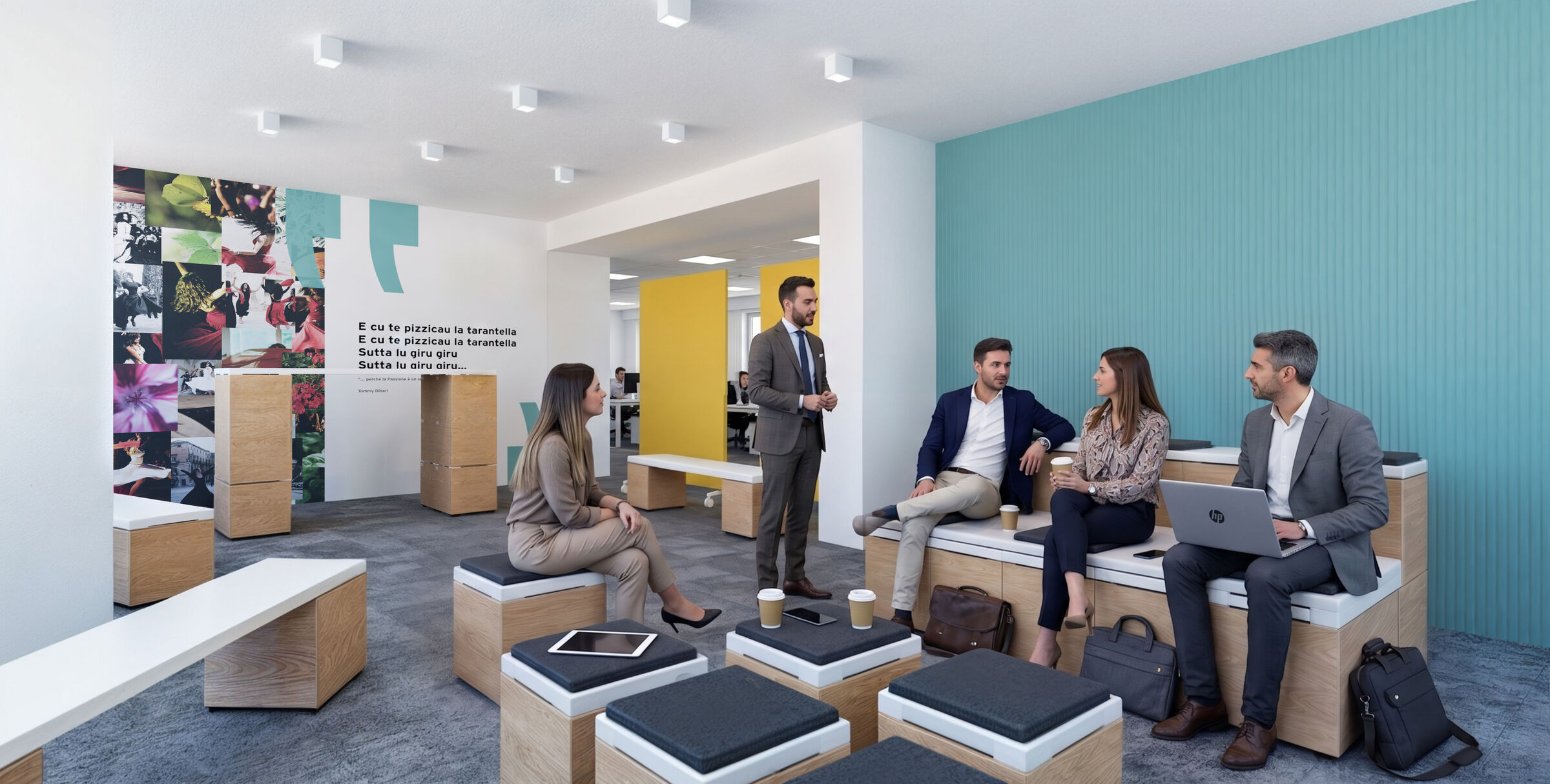 A reconfigurable space with modular seating and a graphic wall: it transforms from an informal area into a meeting place.
