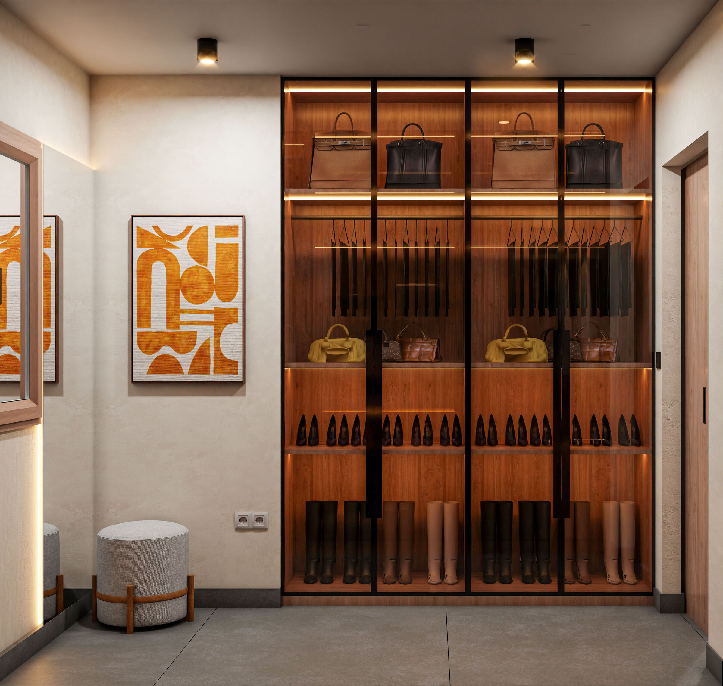 Custom timber cabinetry, illuminated display shelves, and carefully organized storage create a functional wardrobe with a refined contemporary character.