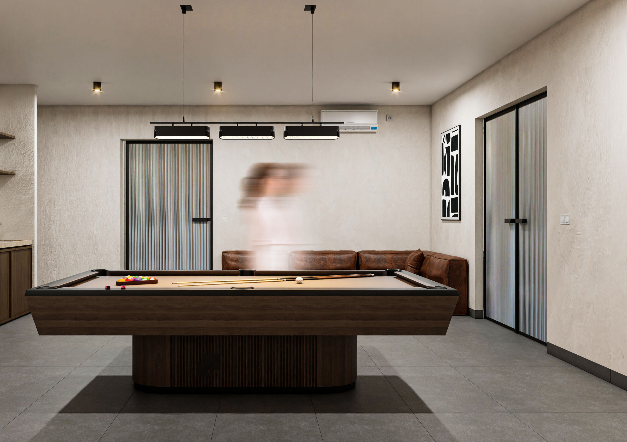 A contemporary playroom featuring a billiards table and integrated lighting provides a dedicated recreational space within the basement of this private villa in Karpathos.