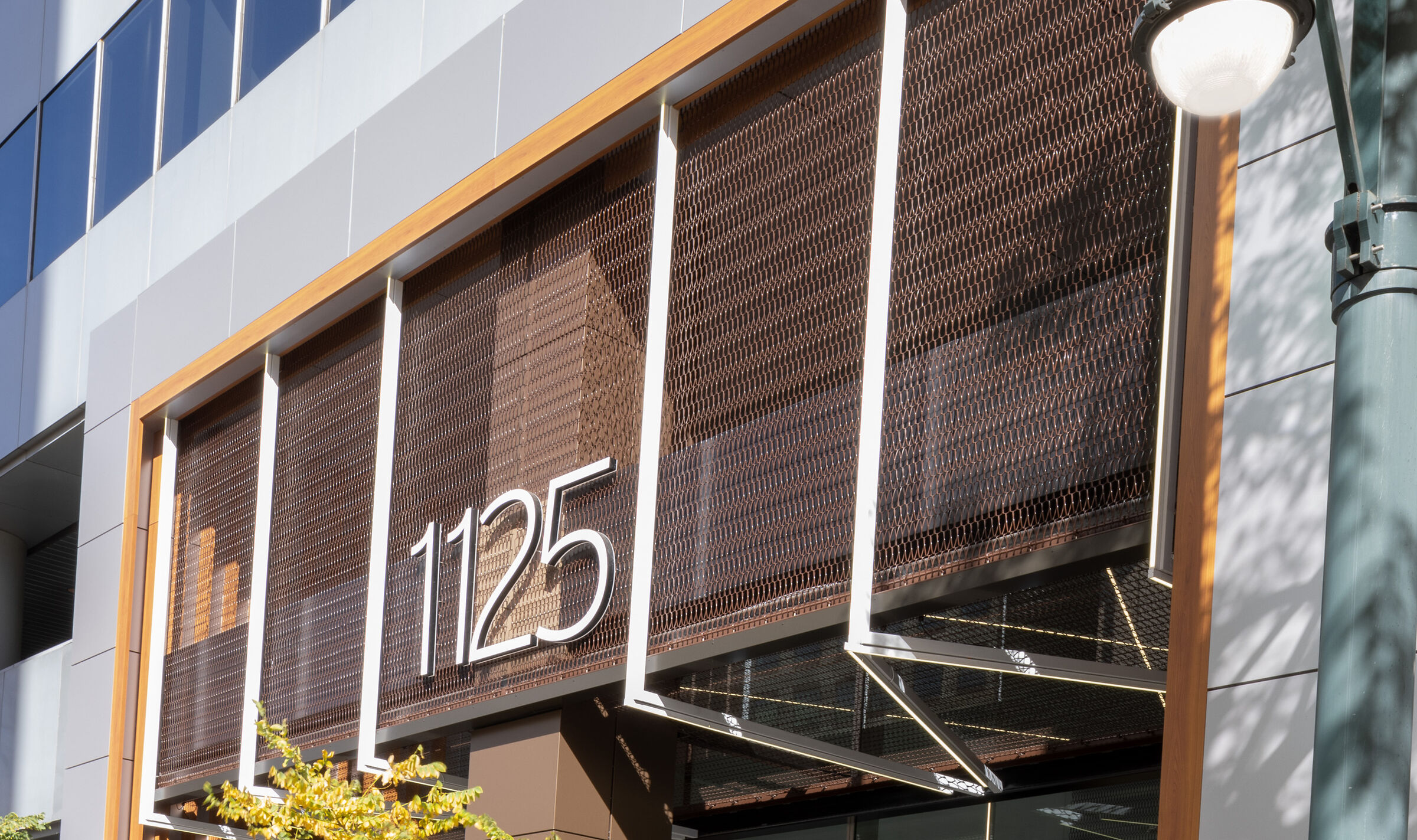Dune 40100 flexible wire mesh continues the textured design element  from the exterior facade into the welcoming space of the lobby