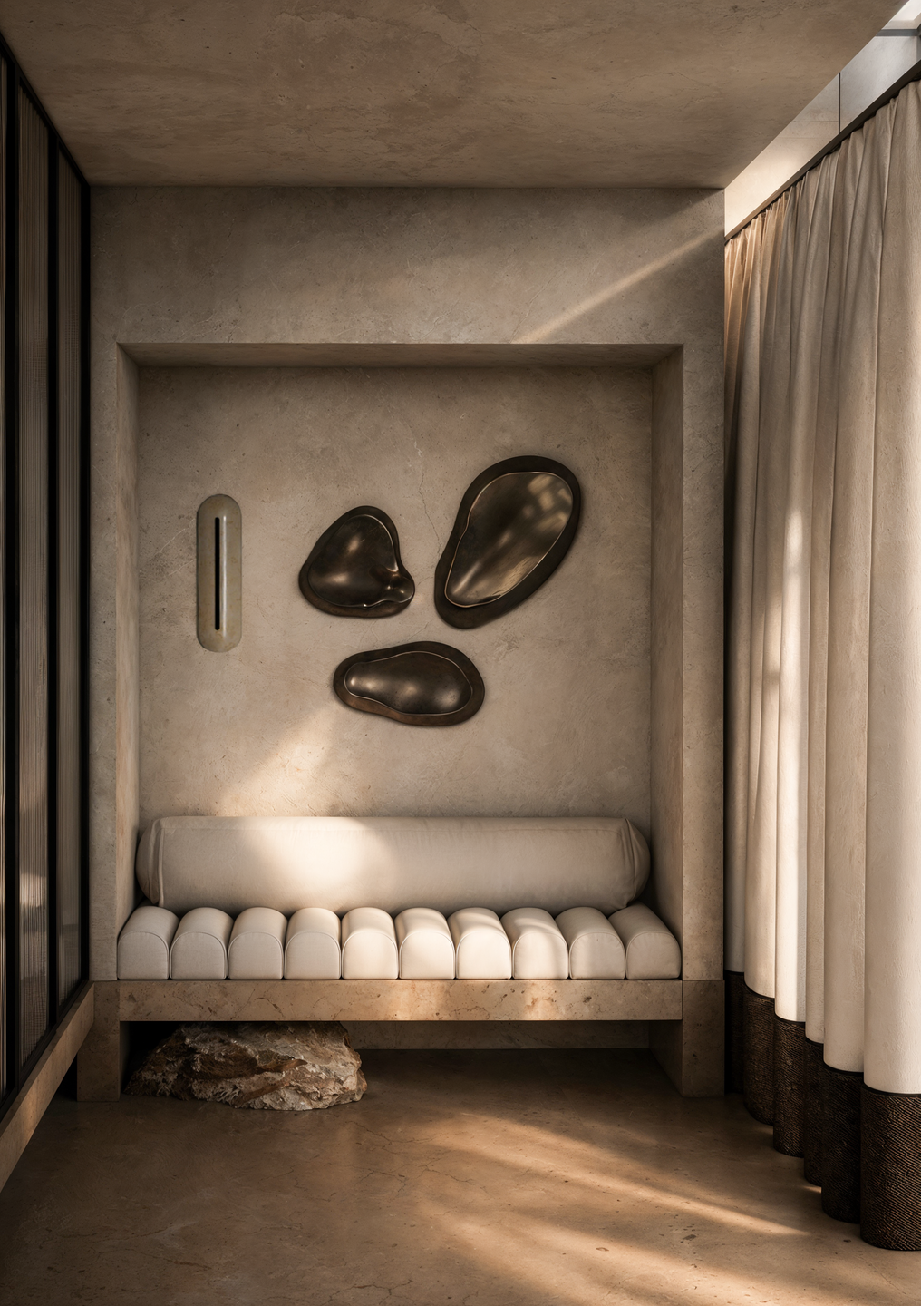 A recessed seating alcove combines sculptural wall artwork, textured plaster, and soft upholstery, creating an intimate architectural moment within the residence.