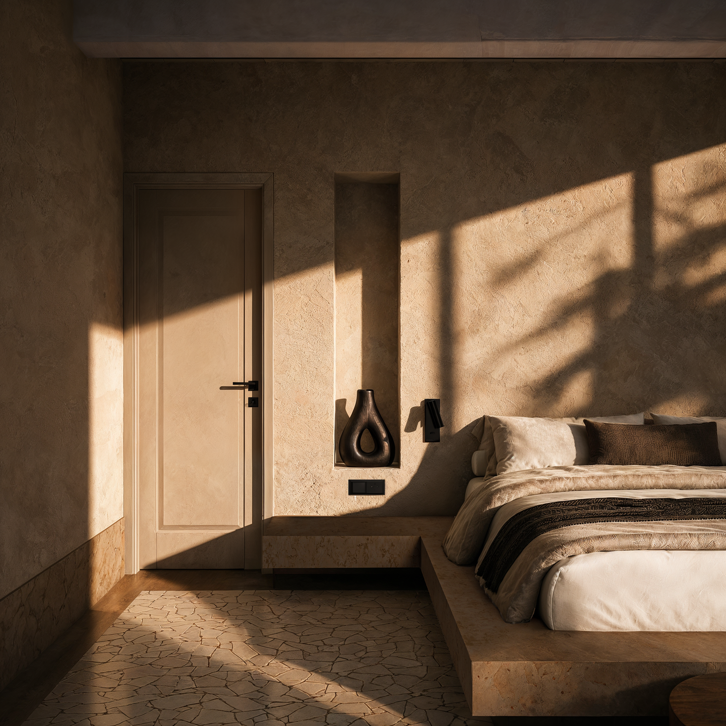 Warm plaster finishes and filtered natural light create an intimate bedroom atmosphere, emphasizing the relationship between architectural surfaces, shadows, and natural materials.