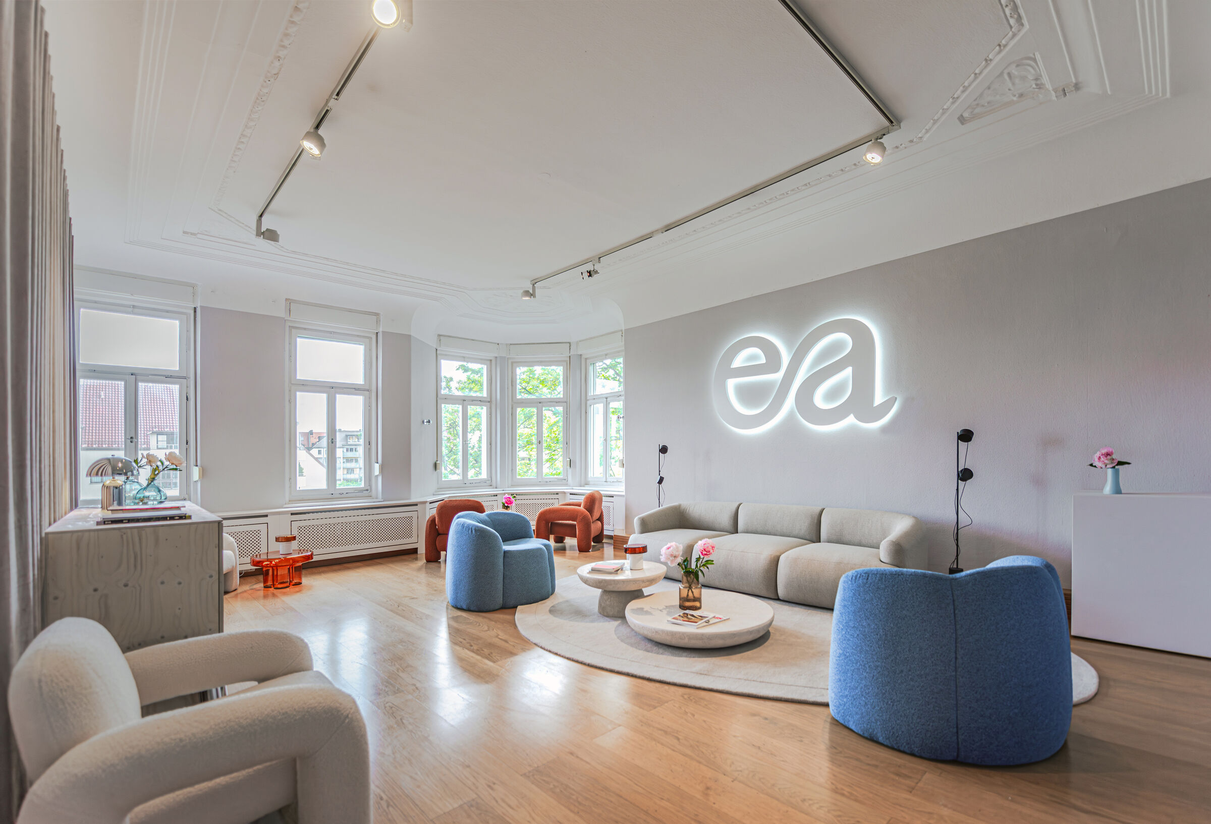 The waiting room plays with calming, yet welcoming color tones.